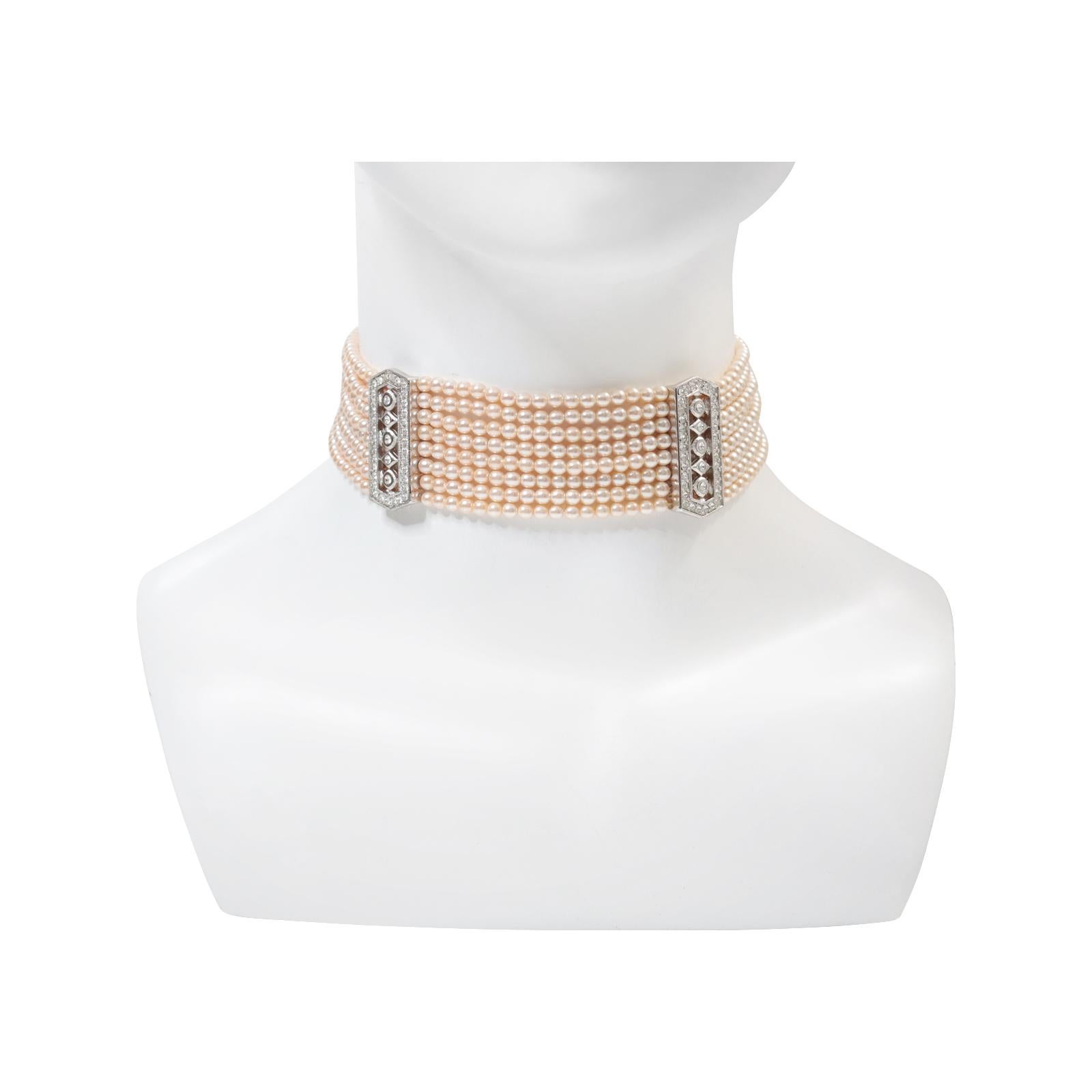 Vintage Silver Tone Faux Pearl with Rhinestone Diamante Choker, Circa 1990s. This smaller faux pearl necklace looks excellent, with two bars of diamante against the ivory and eight rows of pearls. It is a classic necklace that can be worn for
