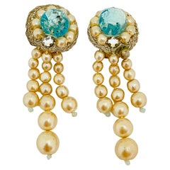 Orecchini a clip di design con strass d
argento vintage e perle penzolanti