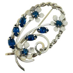 Vintage silver tone sapphire blue rhinestones flower designer brooch