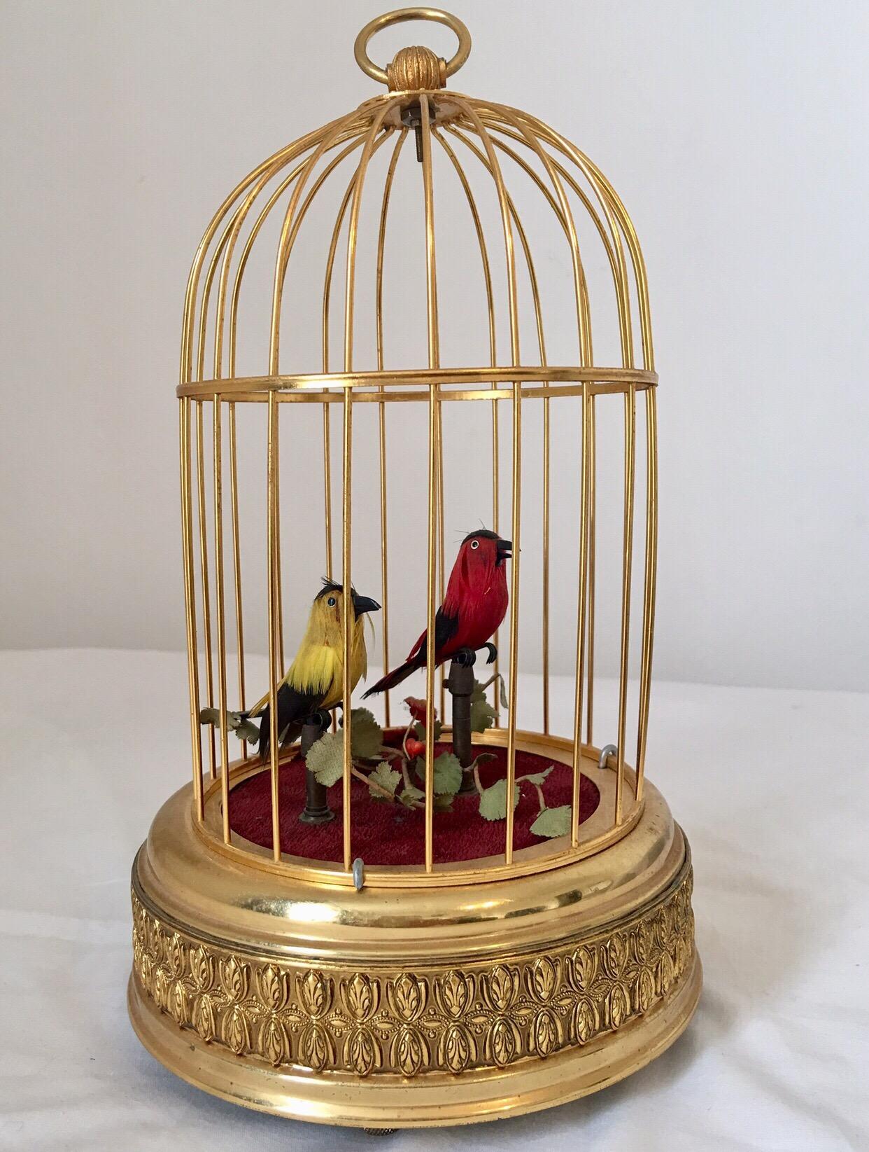 This beautiful vintage dual singing bird cage is in good working order.