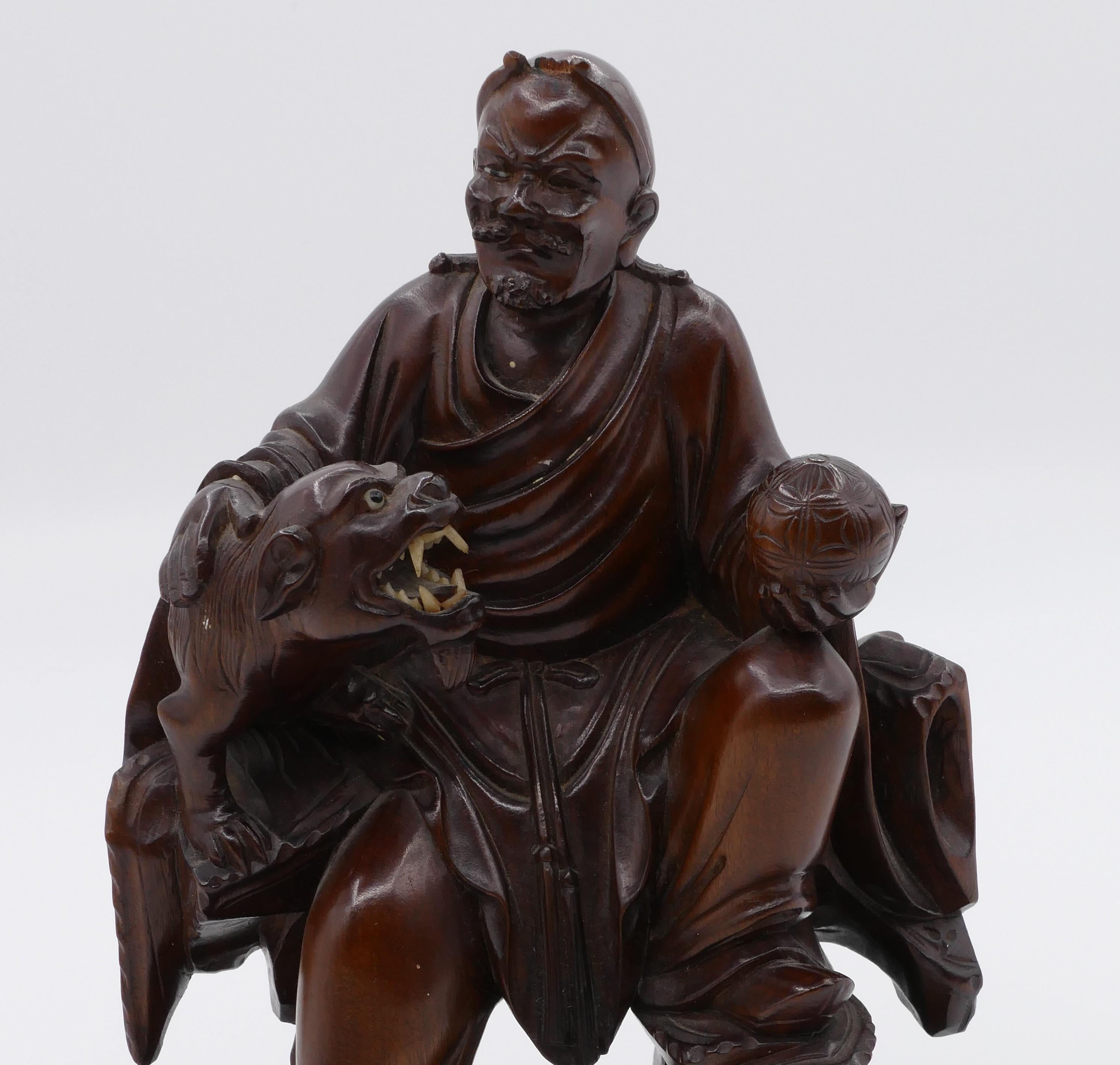 Sitting Lohan, China 20th century is an original decorative object realized in the first decades of the 20th century.

Carved Asiatic Hardwood. 

Handmade in China. 

Fair conditions: some missing parts. 

Precious statue of Lohan sitting