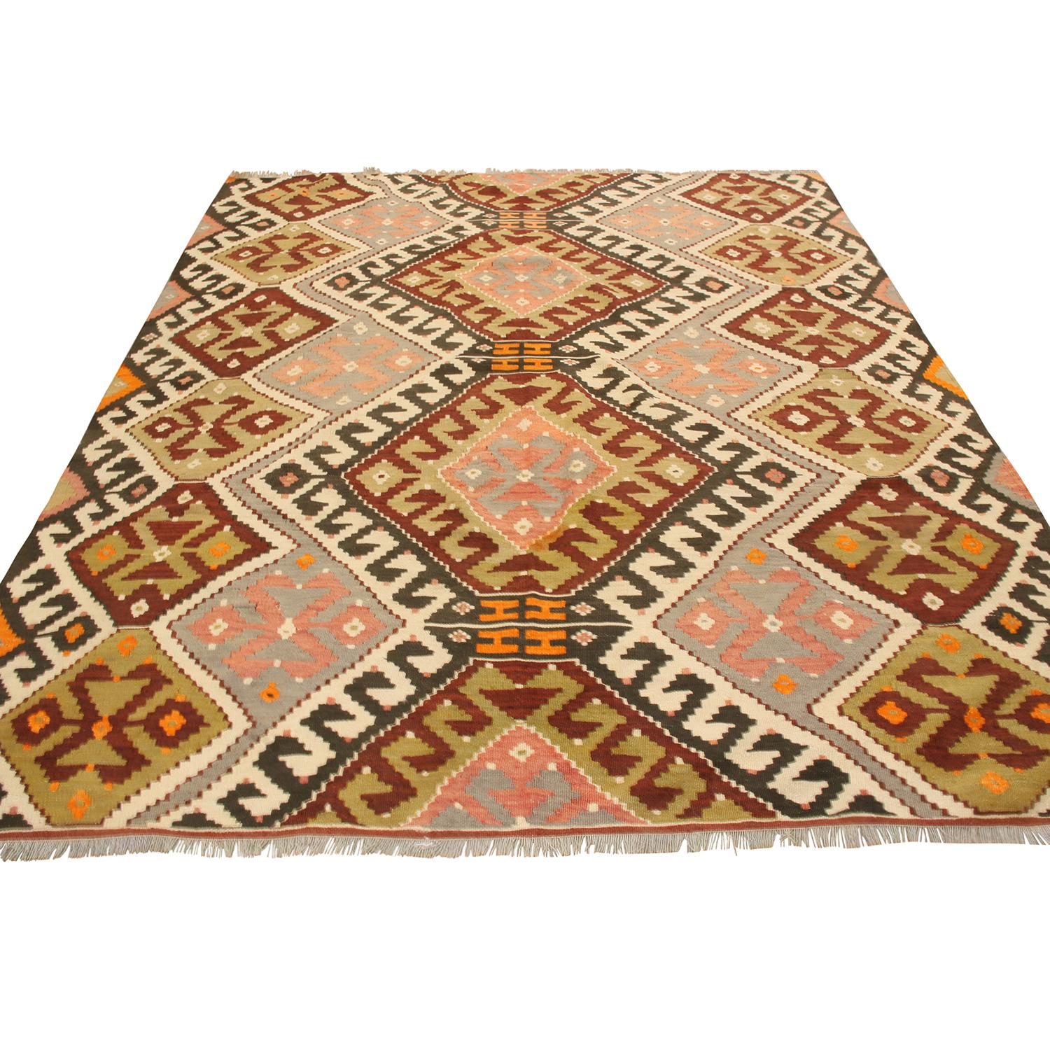 Flat-woven in high-quality wool originating from Turkey between 1930-1940, this vintage Sivas wool Kilim rug enjoys a distinguished tribal influence with a unique, appealing size among its family of Turkish Kilim, complemented by a visually balanced