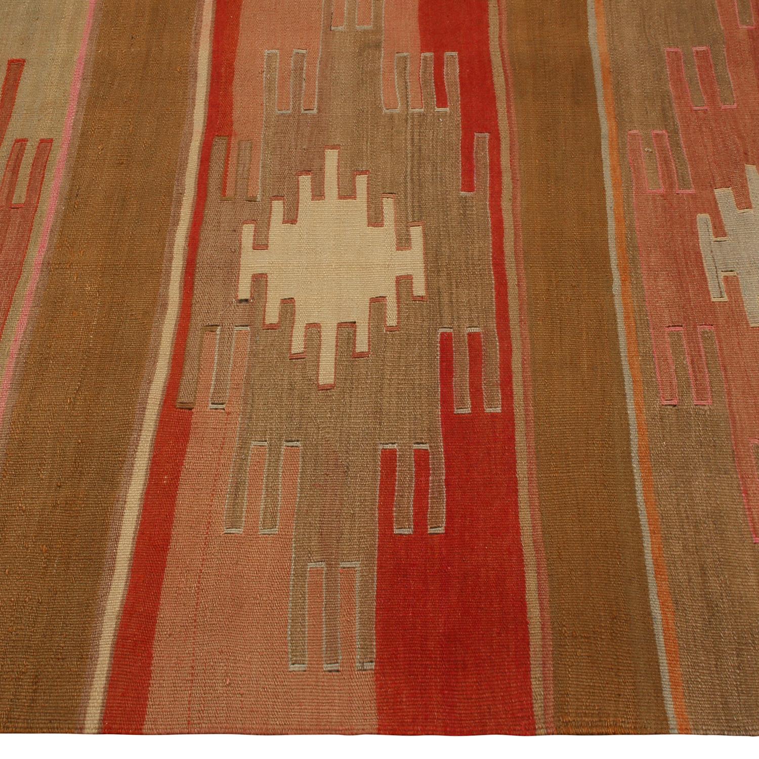 Hailing from Turkey between 1930-1940, this vintage Sivas Kilim rug marries a tasteful, Classic geometric pattern with a rich, unique variation of colorways, enjoying beautifully abrashed crimson and burgundy red, moss and mint green, navy and
