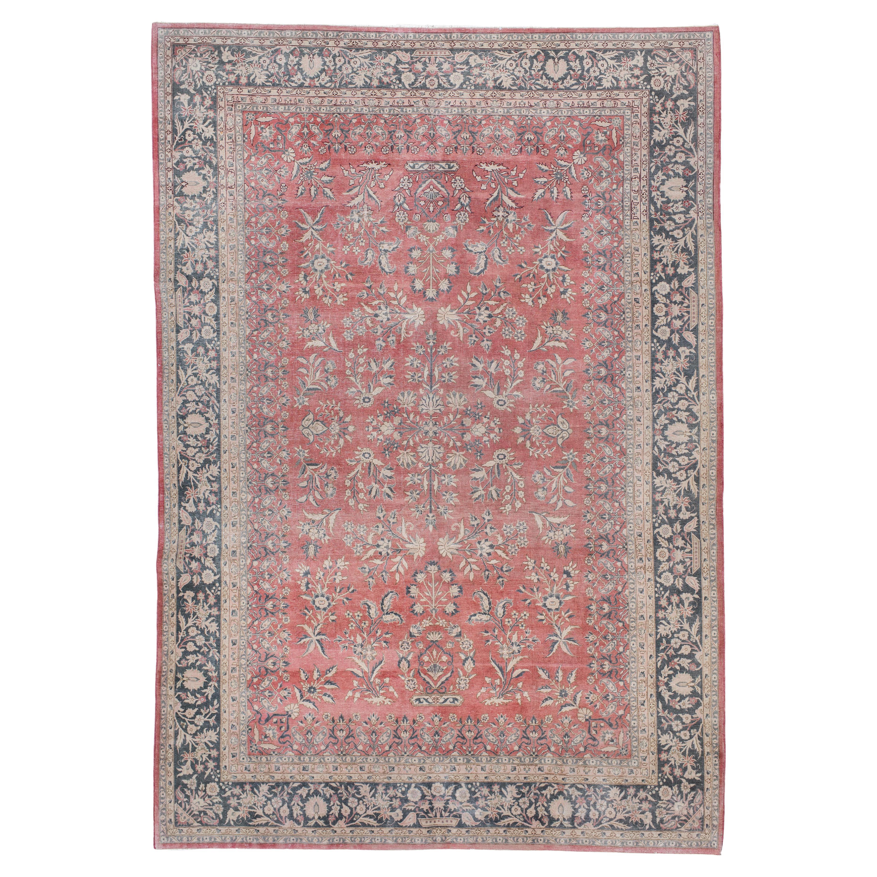 Tapis vintage Sivas avec champ corail et bordure florale anthracite