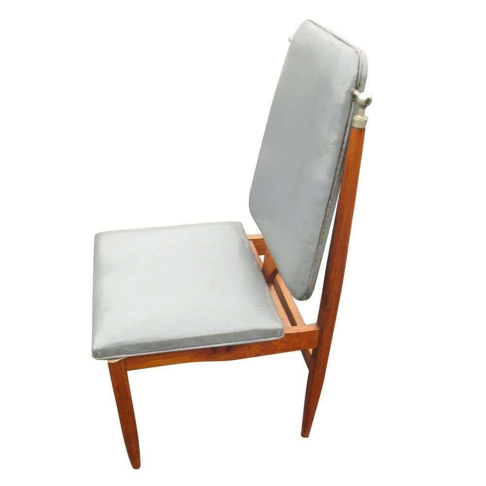 Vintage mid-century set of six (6) dining chair

Grey faux leather upholstered seat and back.
Tapered legs with chrome details.
circa 1960s.

Measures: 17.5
