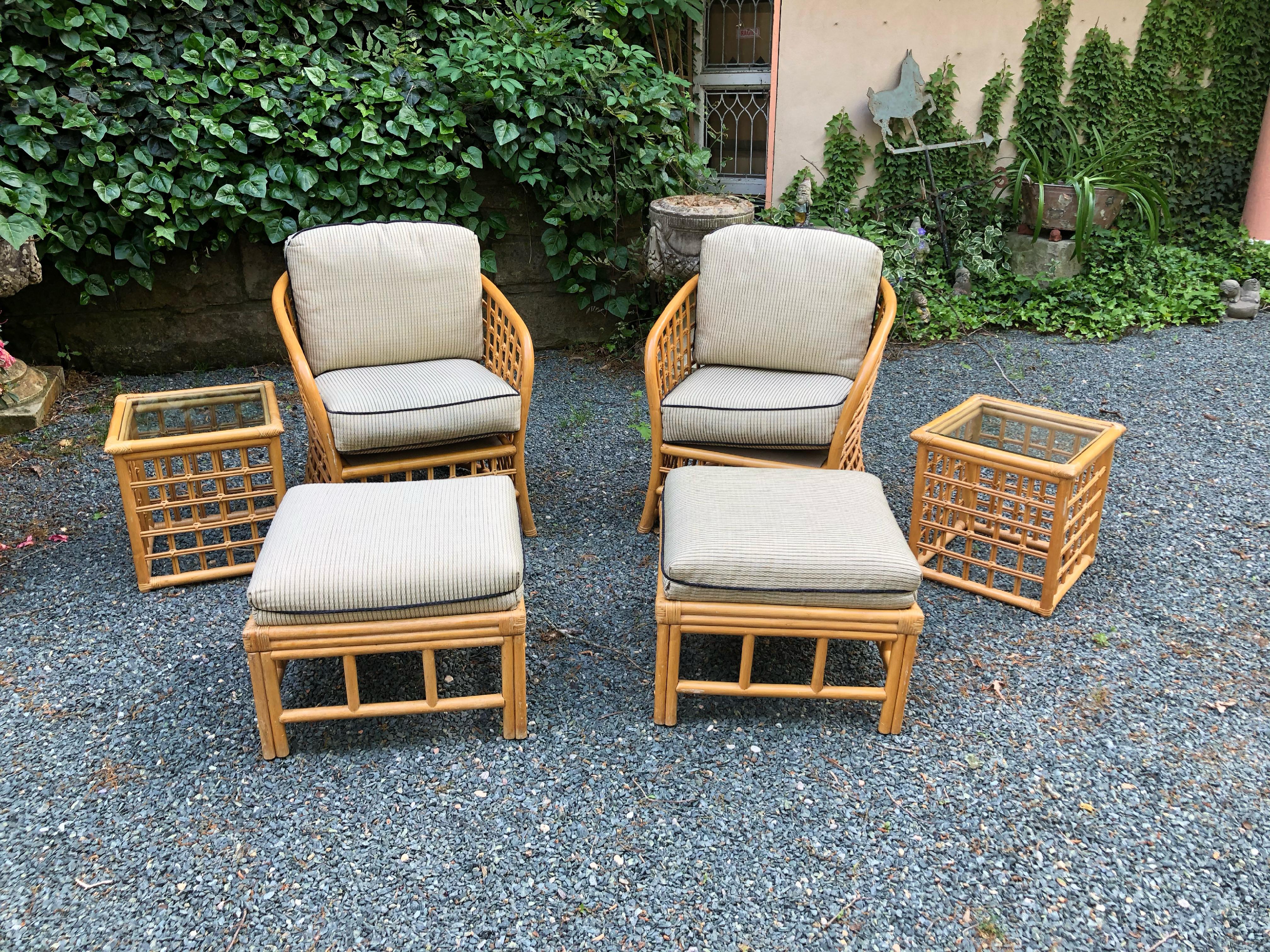 Gorgeous Vintage Rattan Barrel Back Chairs with accompanying ottoman and side tables. In nice vintage condition with minimal surface blemishes. Cushions are still in decent condition but might need new upholstery.

Chairs: 26”W x 30”D x 30.5”H  Seat