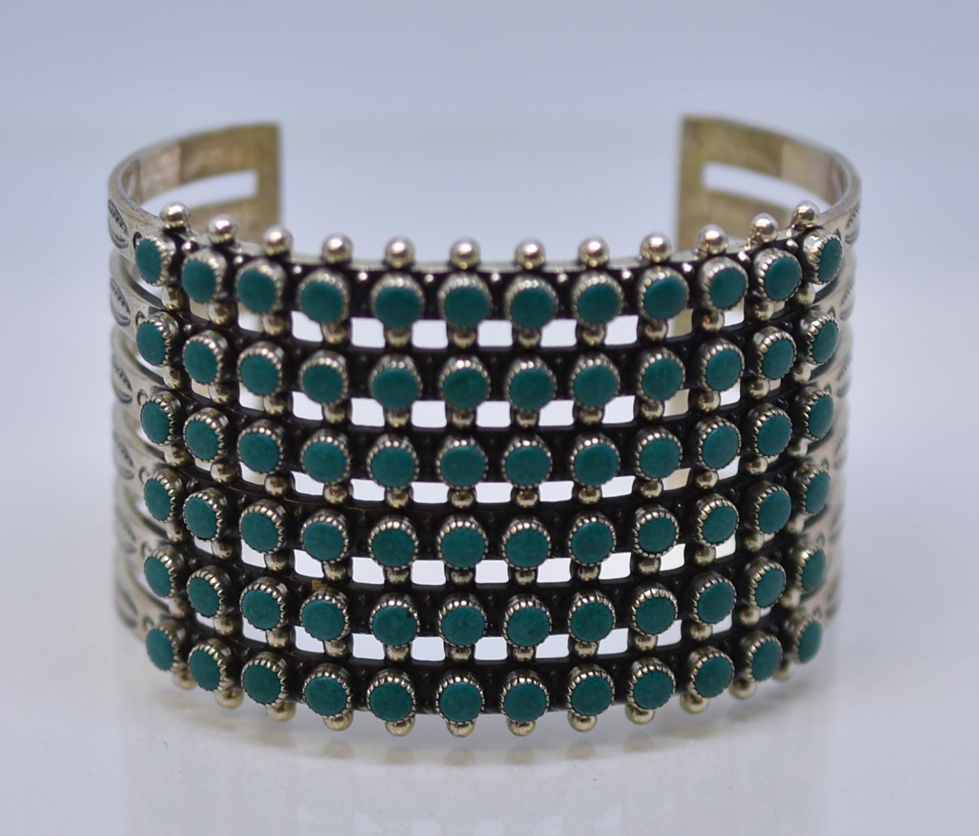 Lovely vintage Zuni 6-row cuff bracelet turquoise decorated with a ‘snake eye’ pattern. The round stones are set in serrated bezels and separated between the rows and on the top and bottom edges with small silver balls. The ends of the bracelet are