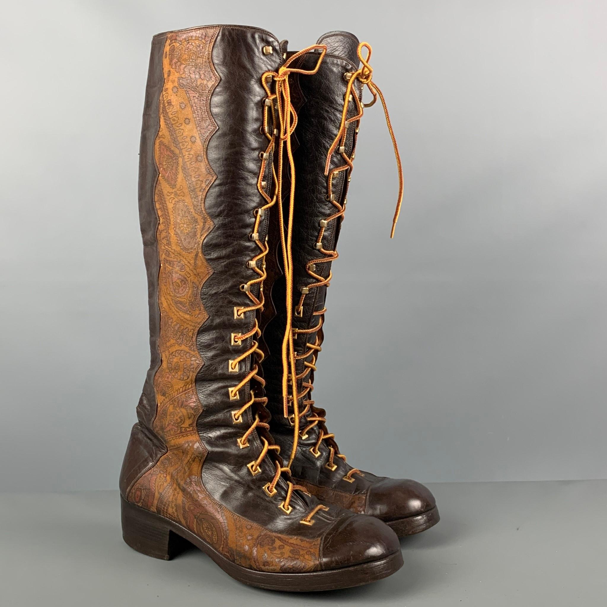 VINTAGE knee high boots comes in a brown and tan leather featuring a round toe, paisley print, lace up closure, and metal gold hardware.

Good Pre-Owned Condition. Moderate signs of wear. As Is.
Marked: 3412 u 565 10

Measurements:

Length: 11.5