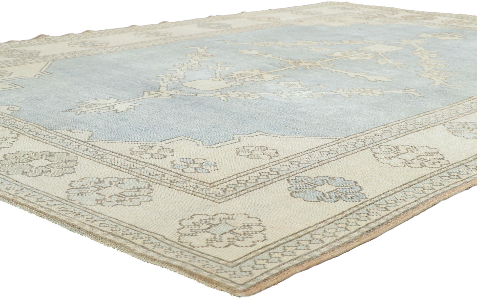 53772 Vintage Sky Blue Turkish Oushak Rug 07'00 x 09'05. Balancing traditional sensibility and relaxed style, this hand knotted wool vintage Turkish Oushak rug is poised to impress. The abrashed sky blue field showcases a botanical pole medallion