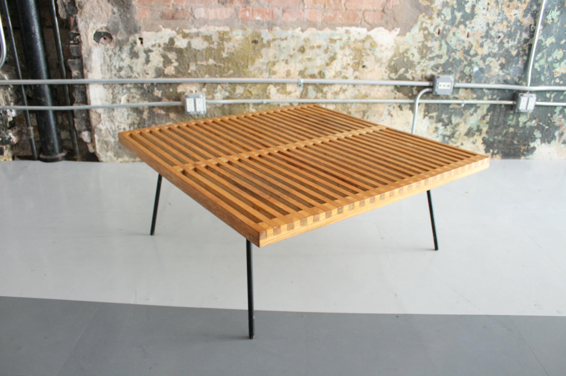 A beautifully crafted vintage table / bench in the Manner of George Nelson or Mel Smilow. Quite possibly a prototype of some sort but, regardless very much in the manner of a California Modern design. The table features stained Oak slats perched