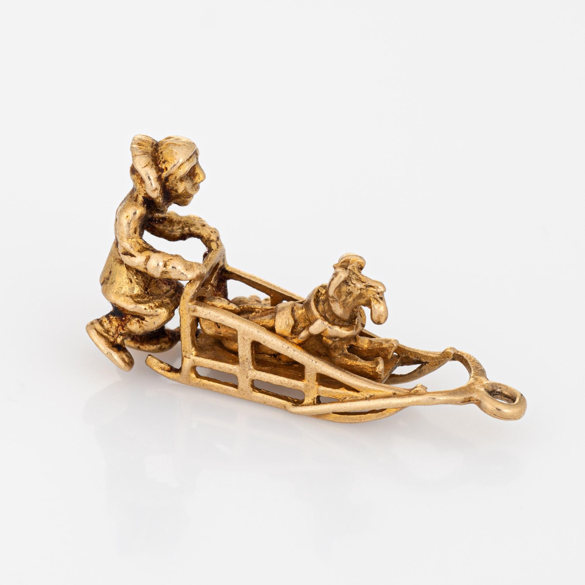 Finely detailed vintage Sled dog charm crafted in 10k yellow gold.  

The Sled features a small dog sitting in the cavity of the charm. The piece can be worn as a charm on a bracelet or as a pendant.

The charm is in very good condition. We have not