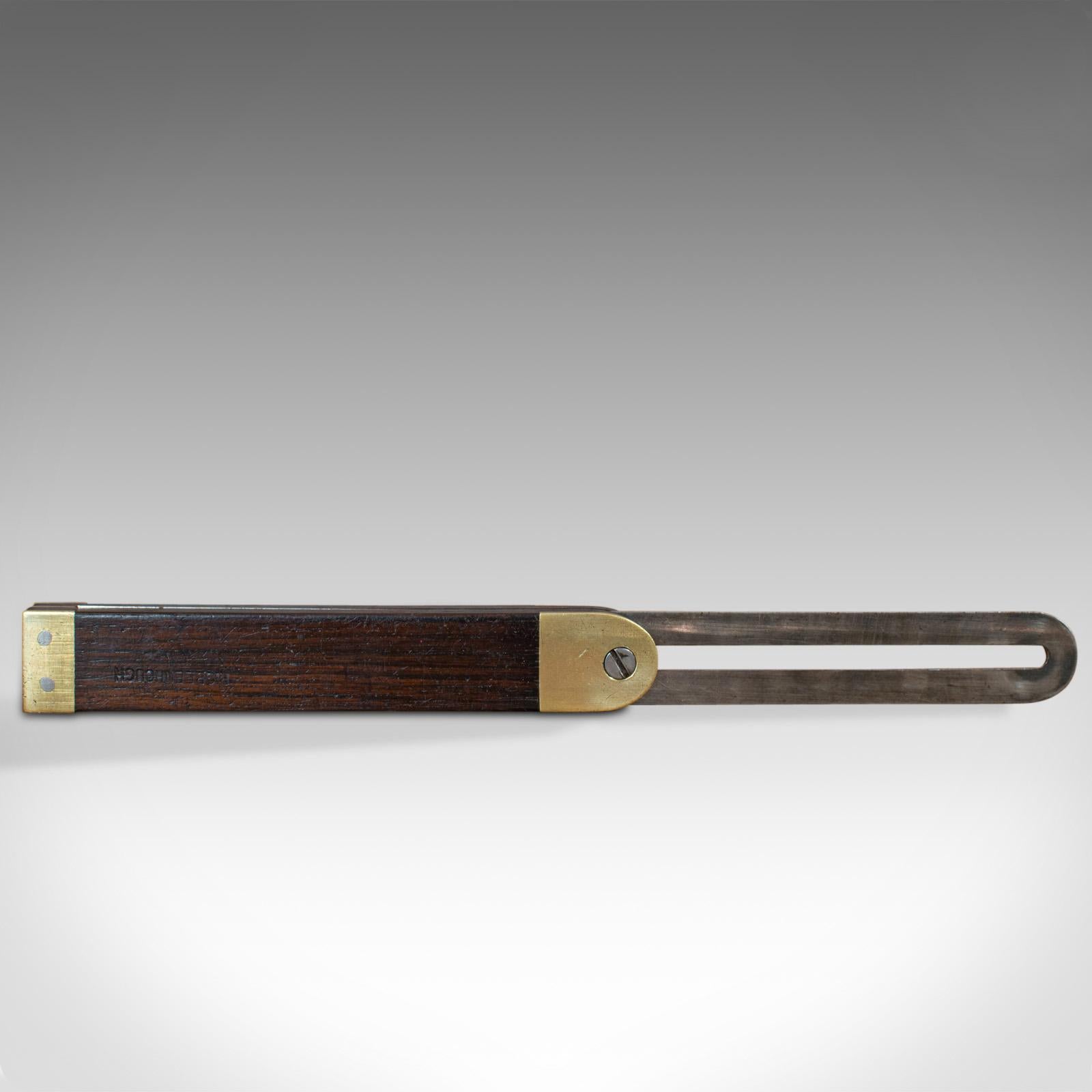 This is a vintage sliding bevel. An English, rosewood and brass craftsman's tool, dating to the mid-20th century, circa 1950.

Attractive vintage tool
Displays a desirable aged patina
Rosewood handle with brass caps offering pleasing