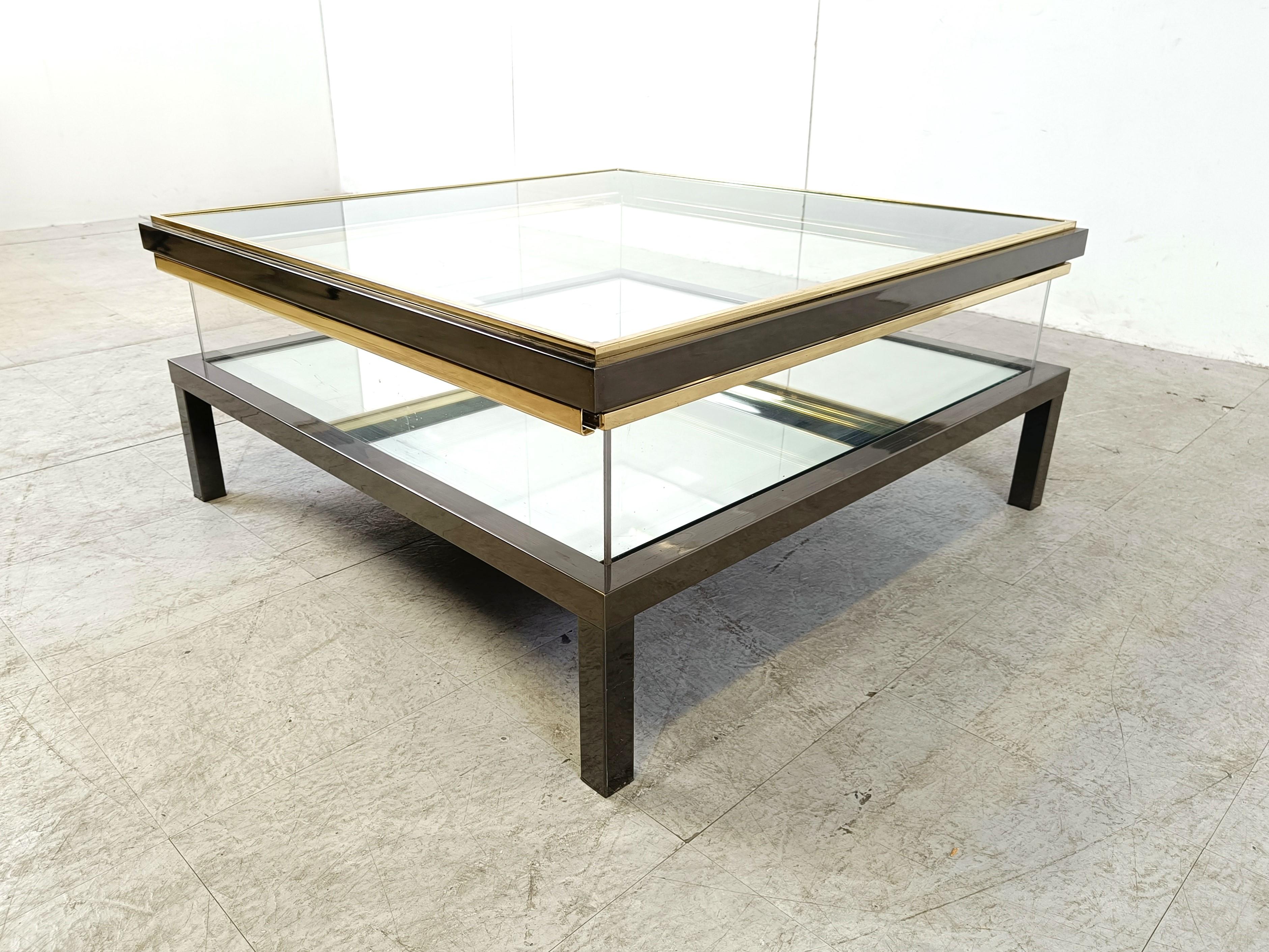 Hollywood Regency Vintage sliding glass coffee table by Maison Jansen, 1970s For Sale