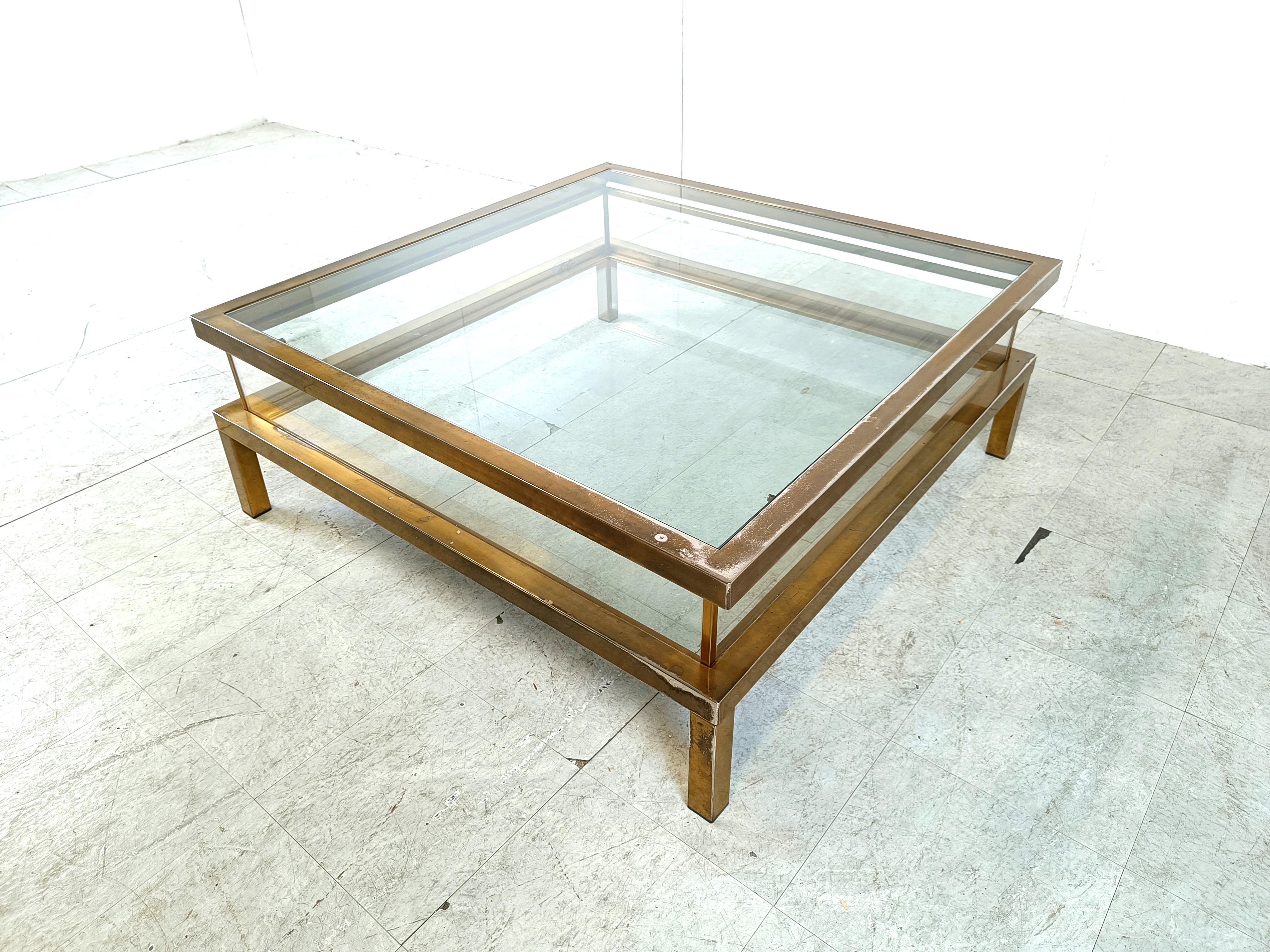 Vintage display coffee table with a sliding glass top.

This luxurious coffee table is made from brass, glass and plexi

It is ideal to display curio and store magazines.

beautiful patina.

1970s - France

Dimensions:
Height: 41cm/16.14