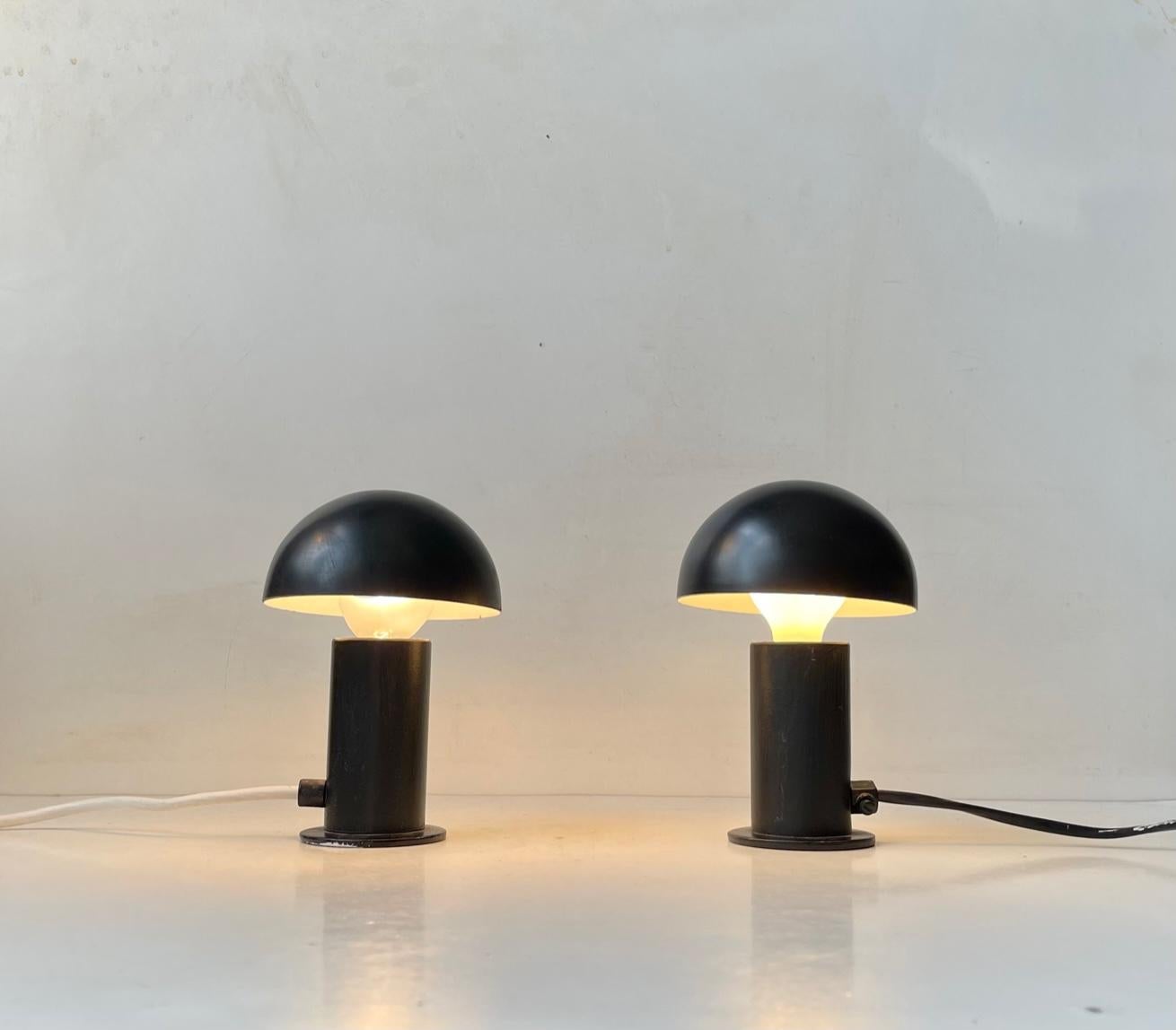 A get vibe of Scandinavian Minimalism and Futurism are present to this small unusual pair of table lights in black powder coated steel. The small globe-shaped shades are adjusted by hand to the desired positions. Very simple and practical. The on/of