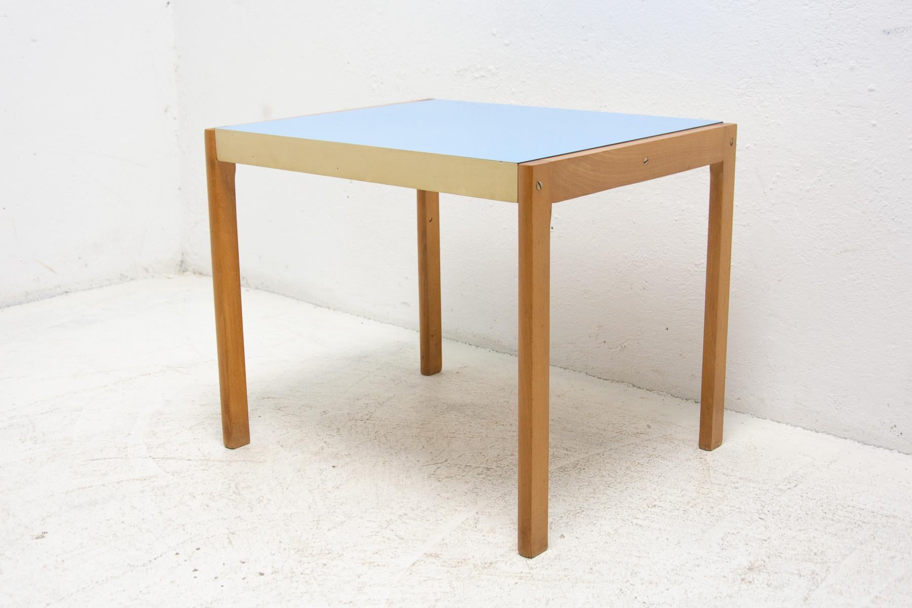 This Vintage small side or coffee table was made by TON company in the former Czechoslovakia in the 1979.

Material: formica, beechwood, plywood. Cool retro piece. In good Vintage condition, showing slight signs of age and using.

Dimensions: 60