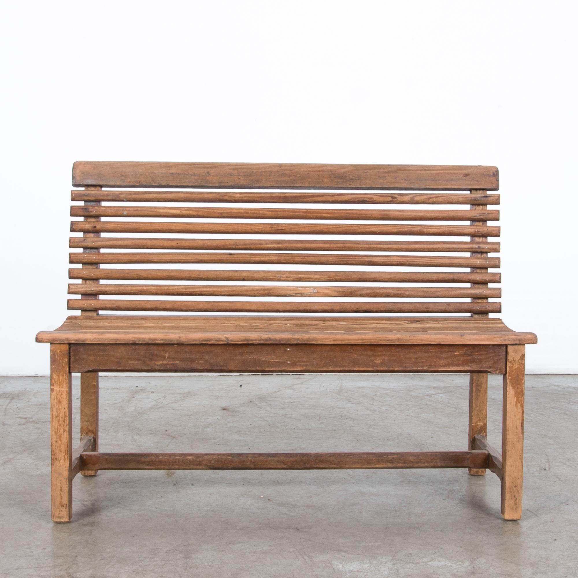 A pine wood children’s bench from France circa 1920. Small scale makes this a unique interior or exterior accent, with attractive warm color re-polished with wax.