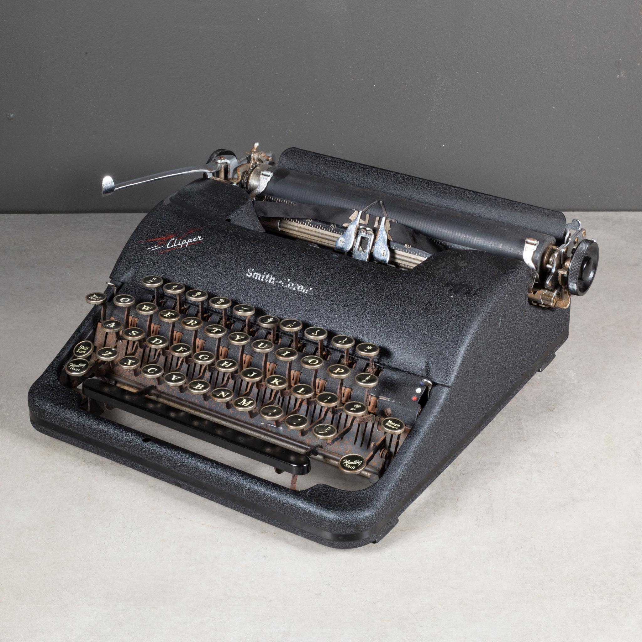 ABOUT

Vintage portable Smith-Corona Clipper four bank typewriter with a black crackle finish. The keys are nickle and black with white letters. This typewriter has smooth typing. The ribbon is new. It has retained its original finish with minor