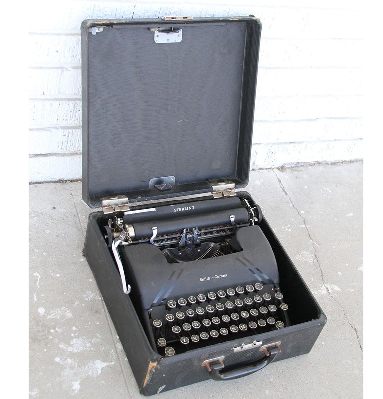 Vintage Smith corona typewriter and case.

 Black Smith Corona standard typewriter made in USA. This typewriter features round glass keys. The carriage advances very smoothly and the return, spacing, bell and all other features work great as well.