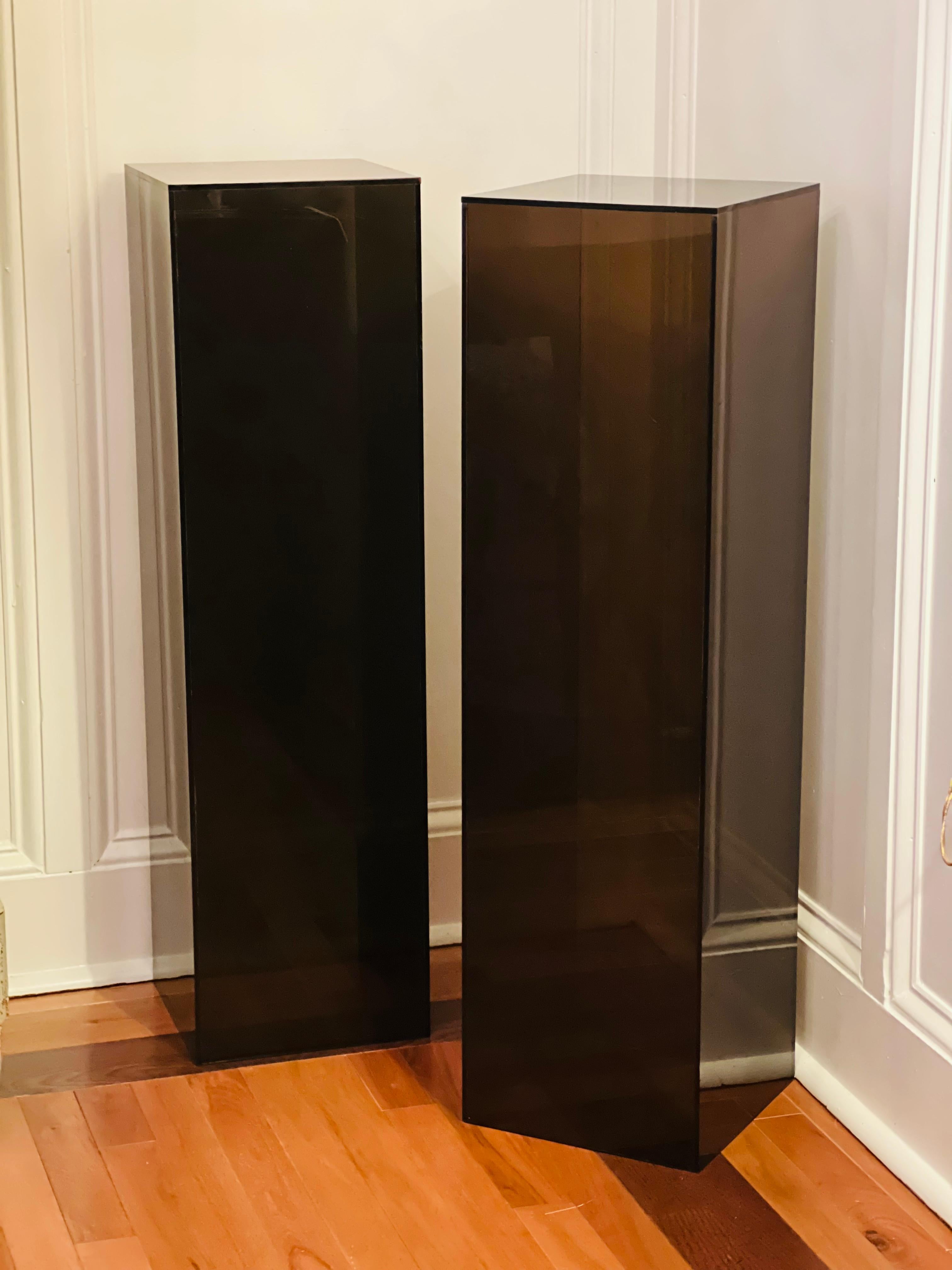 Great pair of vintage smoked lucite pedestals. Both are identical at 36