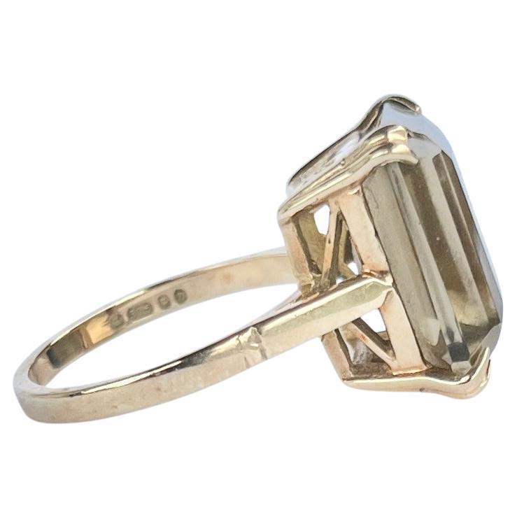 The smokey quartz stone in the ring is large and gorgeous! It is deep in colour and held by simple claws on a modernistic gallery and shank. The ring is modelled in 9carat gold. Fully hallmarked London 1978.

Ring Size: M or 6 1/4 
Stone Dimensions: