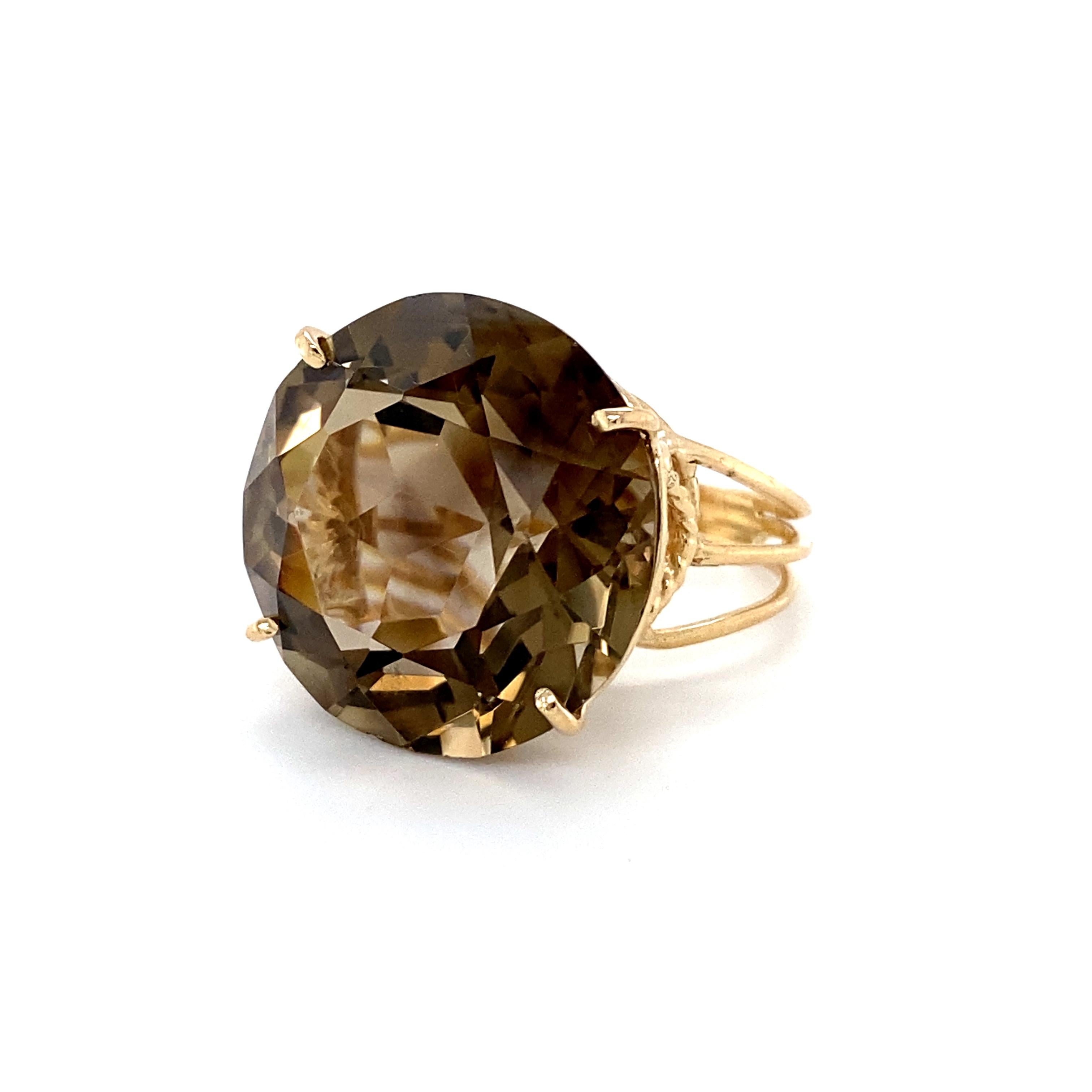 This Vintage Smokey Quartz Ring is just fantastic! Crafted in 14K Yellow Gold, this piece really brings the wow factor! The solitaire is a whopping 25 carats, transparent and inclusion free, and of fine quality, set in a beautiful basket with rope