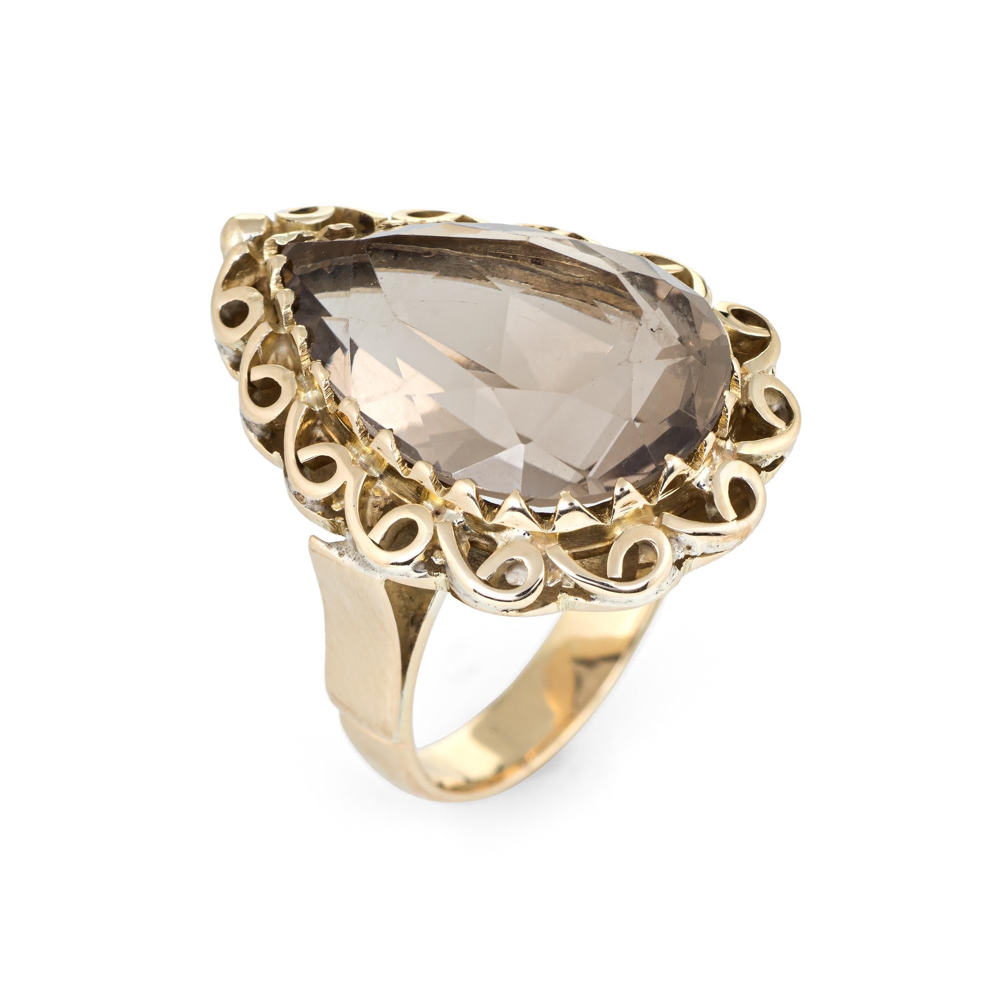 Elegant vintage smoky quartz cocktail ring (circa 1960s to 1970s), crafted in 14 karat yellow gold. 

Faceted pear cut smoky quartz measures 19mm x 13mm (estimated at 15 carats). The quartz is in excellent condition and free of cracks or chips.

The