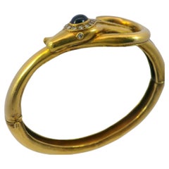 Vintage Snake Bangle Bracelet with Diamonds and Sapphire Head in 14 Karat Gold