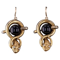 Pendientes vintage con forma de serpiente de oro de 14 quilates y ónix