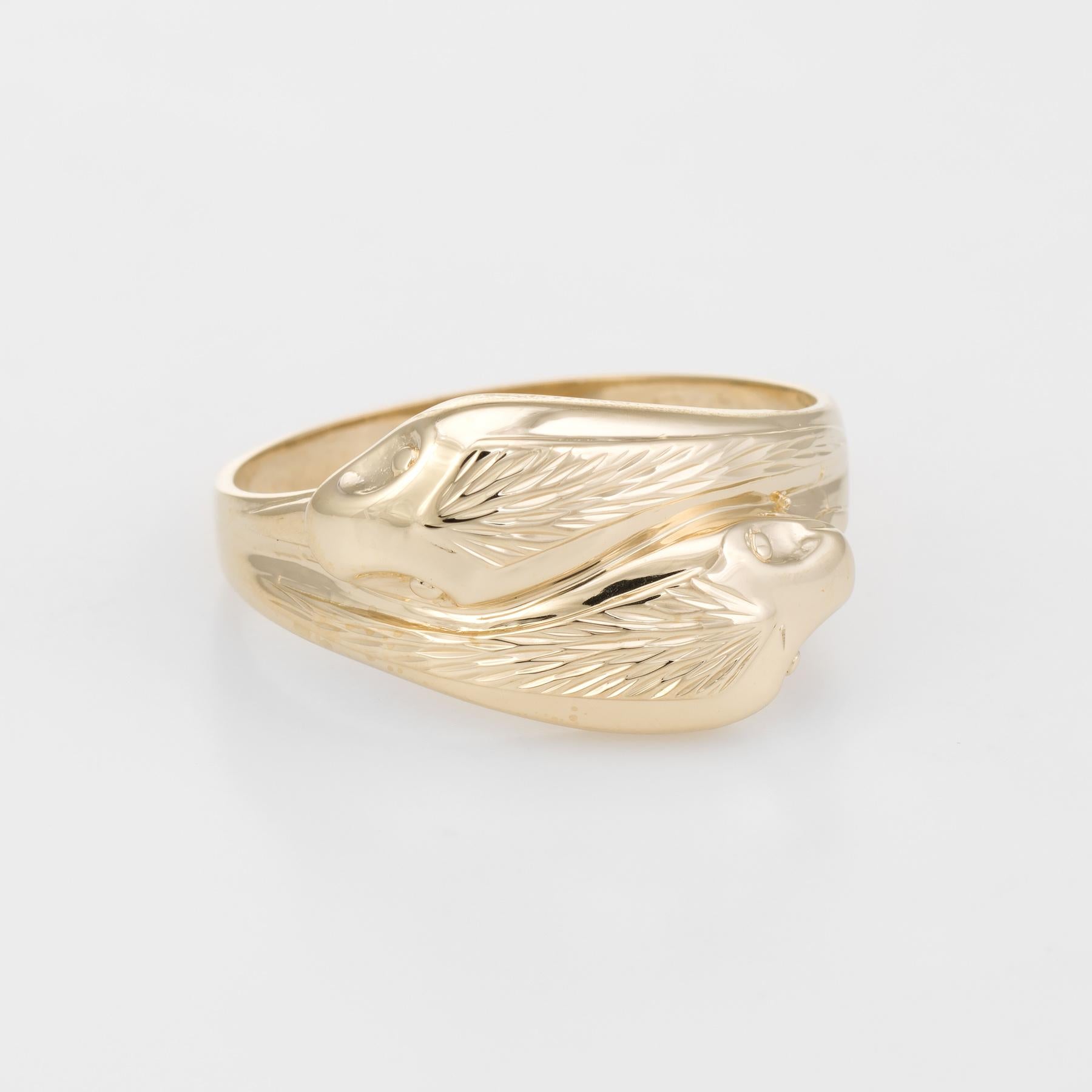Finely detailed vintage double headed snake ring, crafted in 9 karat yellow gold. 

For centuries the snake has represented eternal love and faithfulness. The ring is great for stacking (looks great worn on the pointer finger), alone or with your