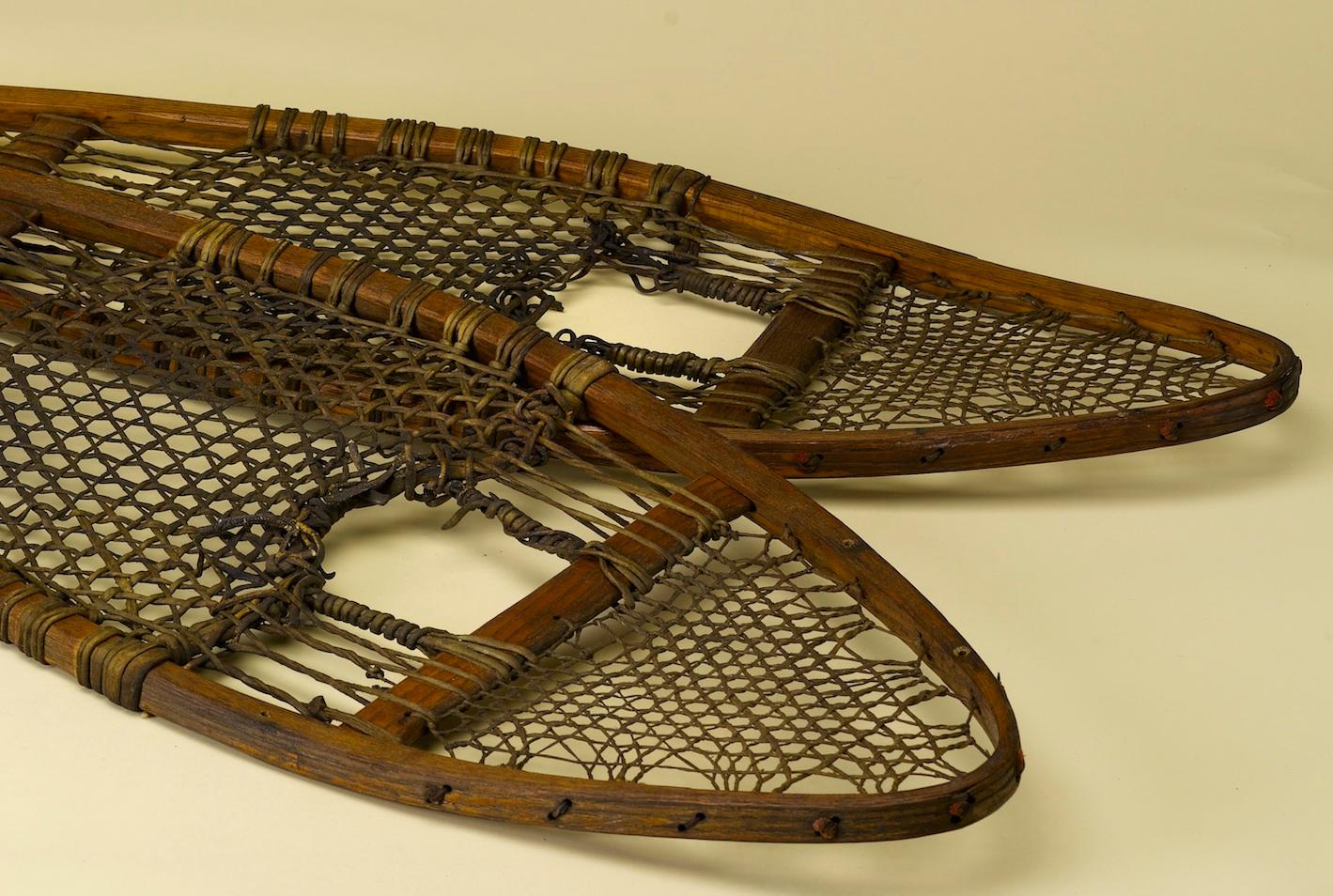 This intriguing pair of snowshoes dates to circa 1930s. Each shoe has a wooden frame and a complicated weave of rawhide to allow an individual to effectively strap into the snowshoe and maneuver across winter terrain. 

Shaped into the Huron style,