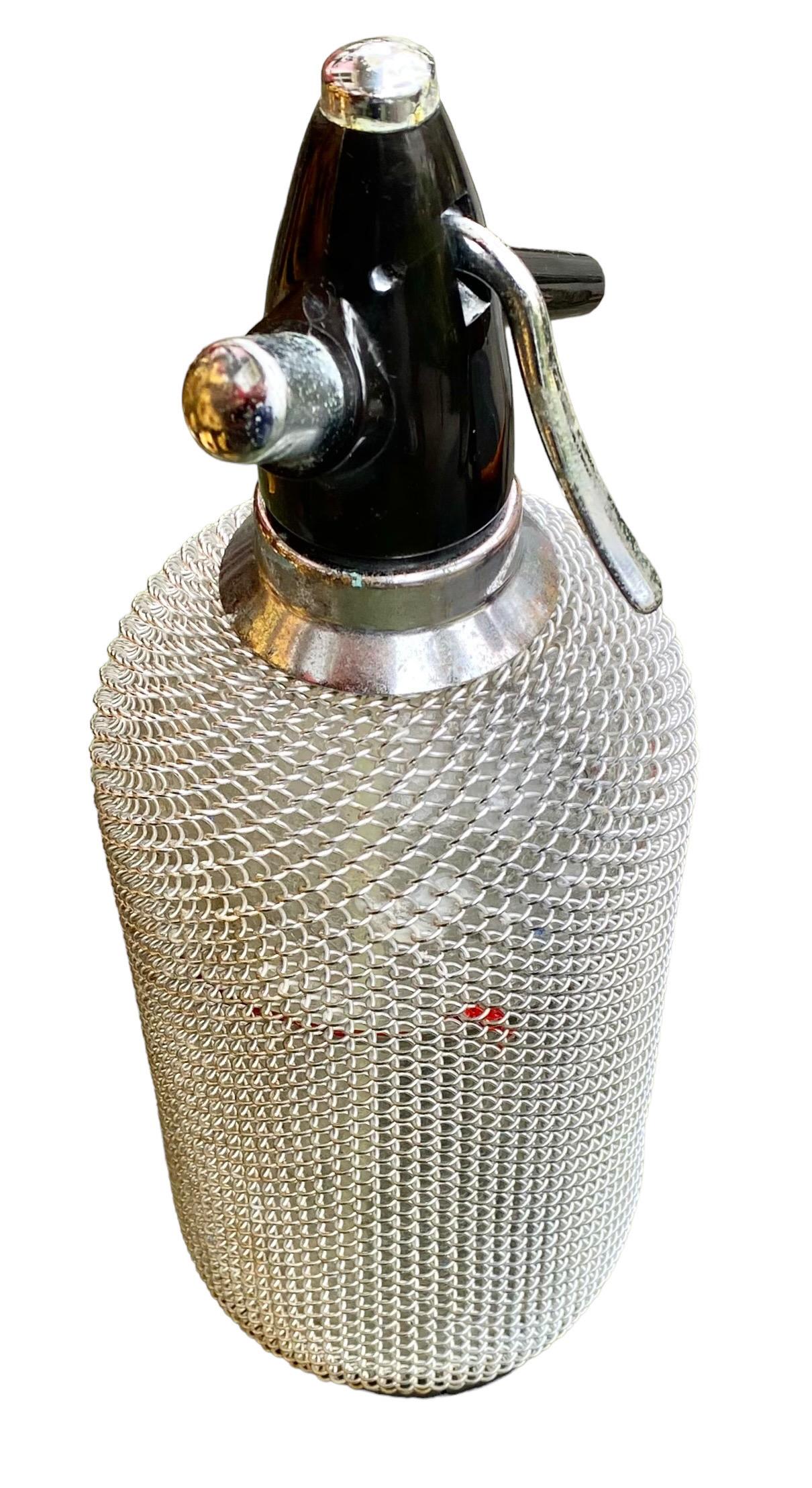Mid-20th Century Vintage Soda Siphon Seltzer Glass Bottle with Metal Mesh  For Sale