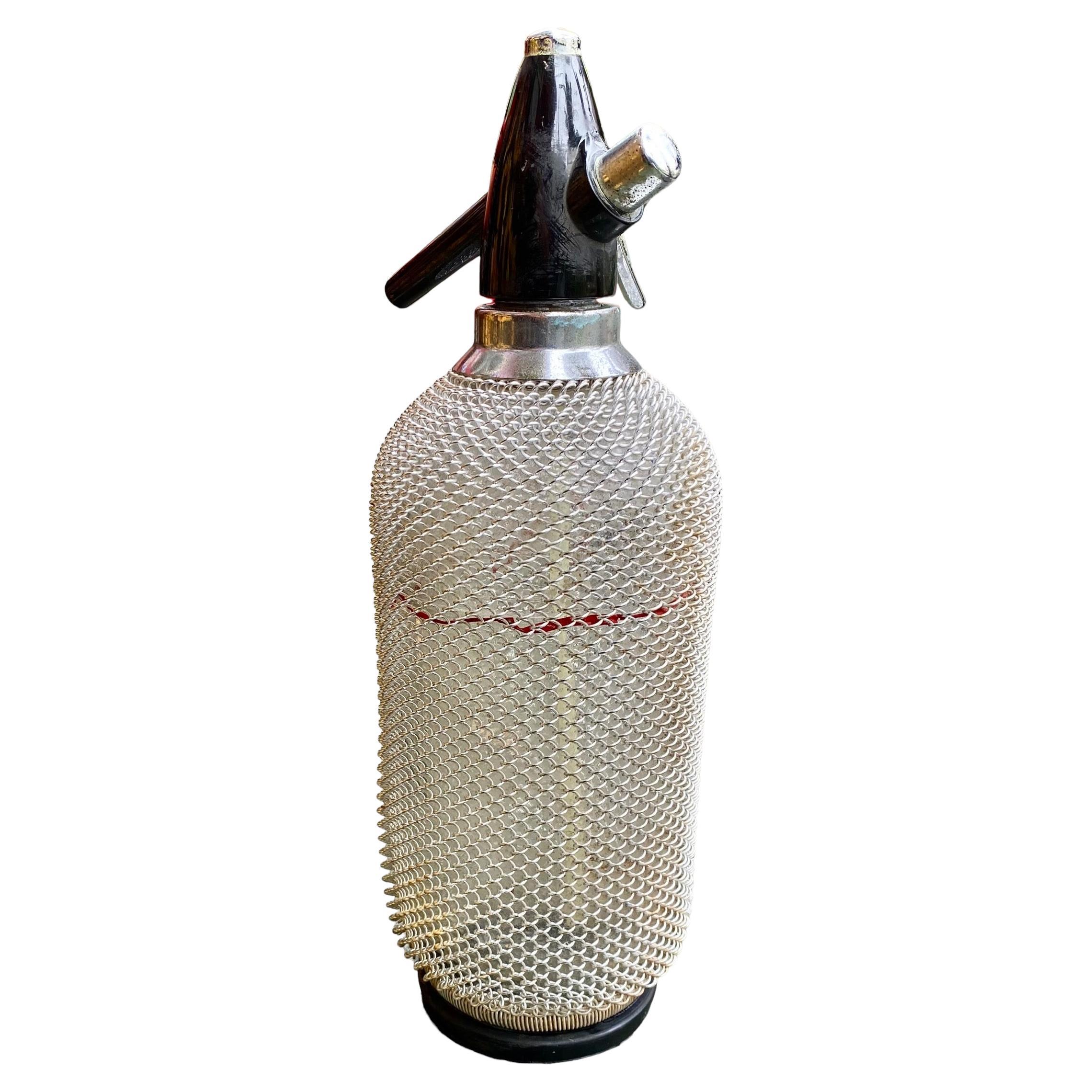 Vintage Soda Siphon Seltzer Glass Bottle with Metal Mesh  For Sale