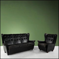 Vintage sofa and armchair black leather with beautiful patina
