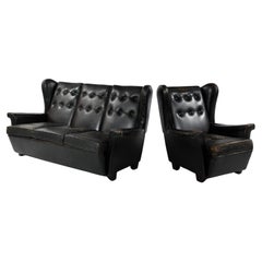 Vintage sofa and armchair black leather with beautiful patina