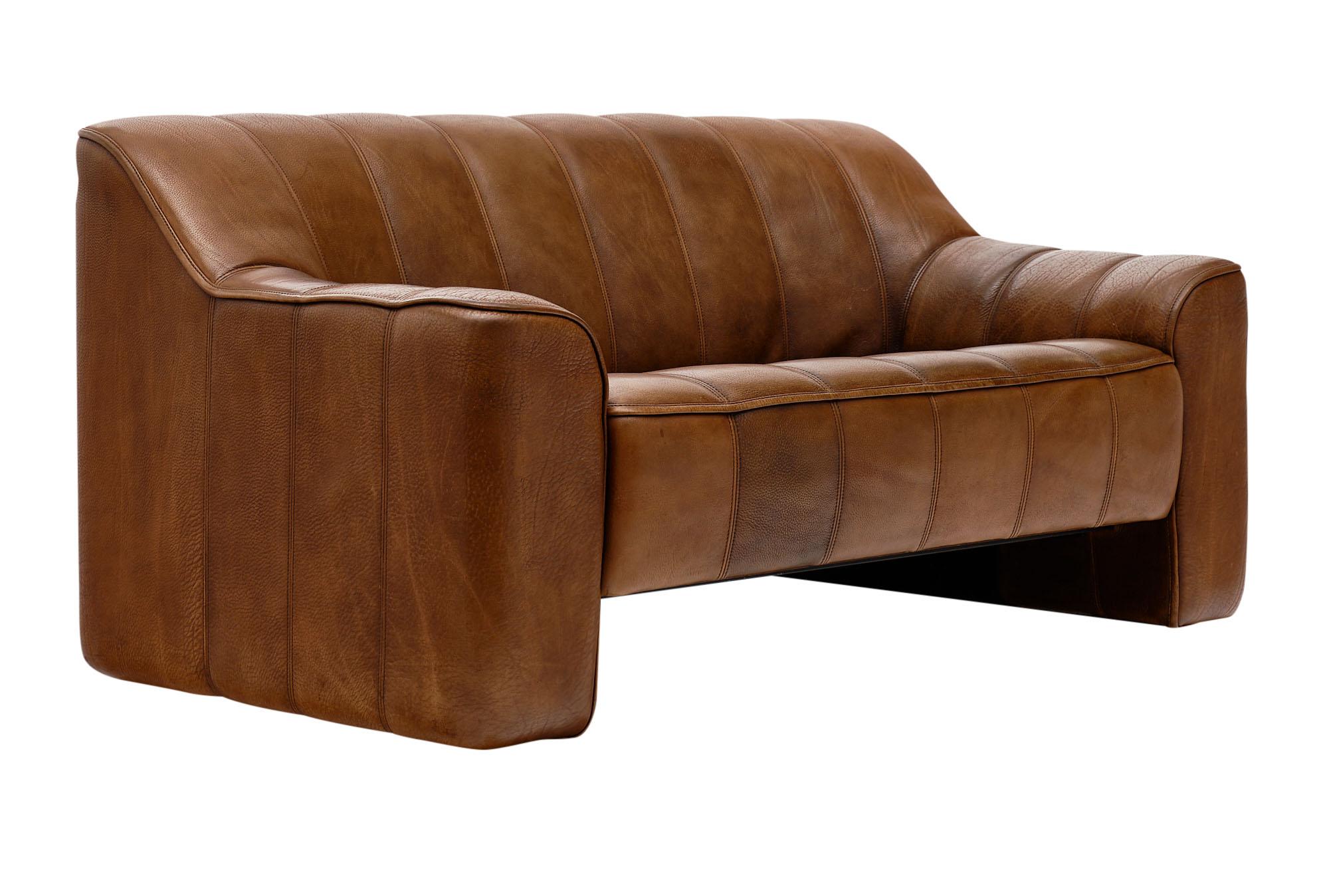 Leather sofa (DS44) by iconic Swiss brand De Sede. This piece has thick patinated Buffalo leather with a bottom that pulls out for a deeper seat when needed. It is very comfortable and in excellent condition.