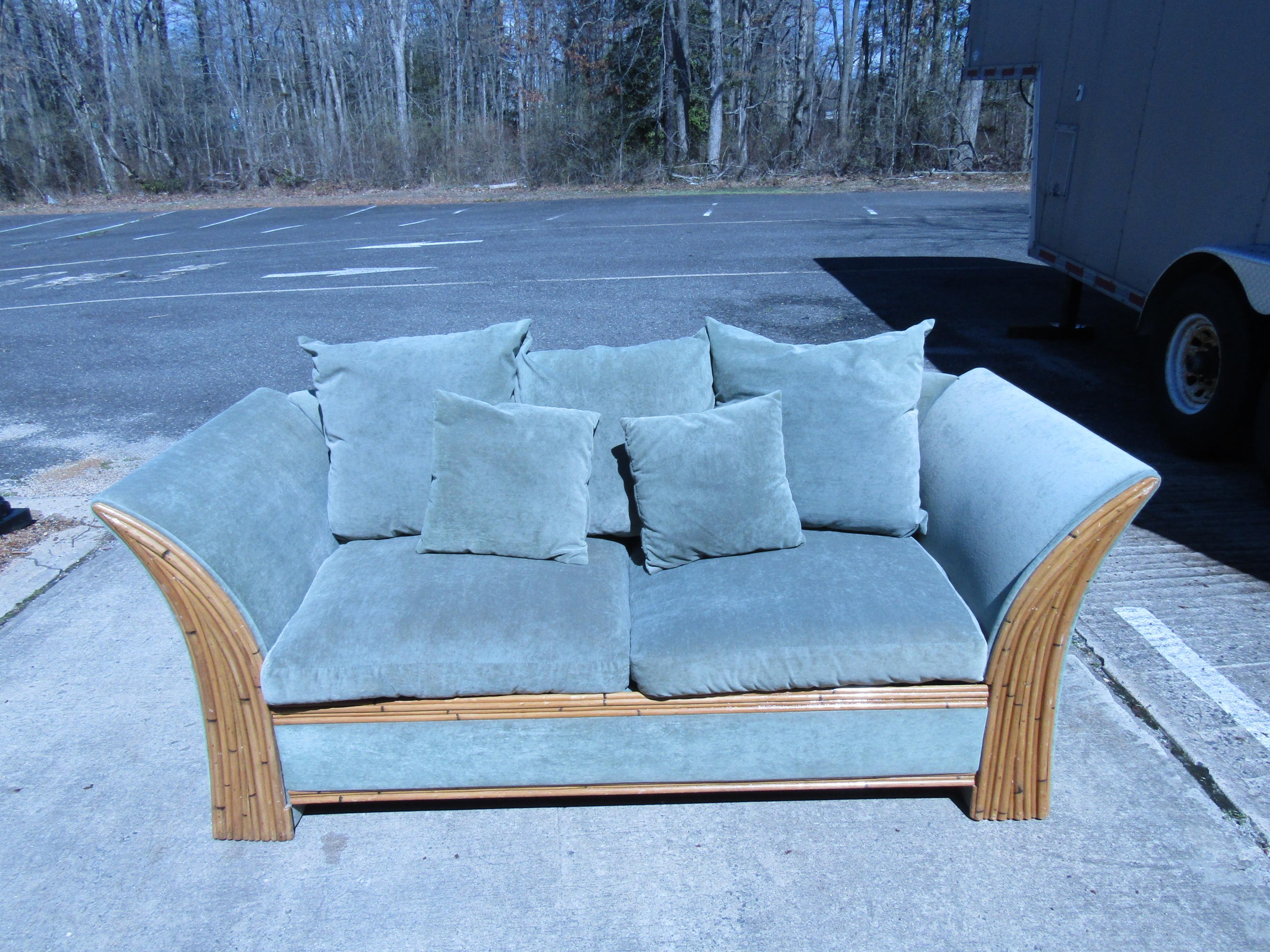 This vintage sofa is styled after the designs of Adrian Pearsall, with a unique Mid-Century Modern shape and interesting combination of upholstery and faux bamboo. Please confirm item location with seller (NY/NJ).