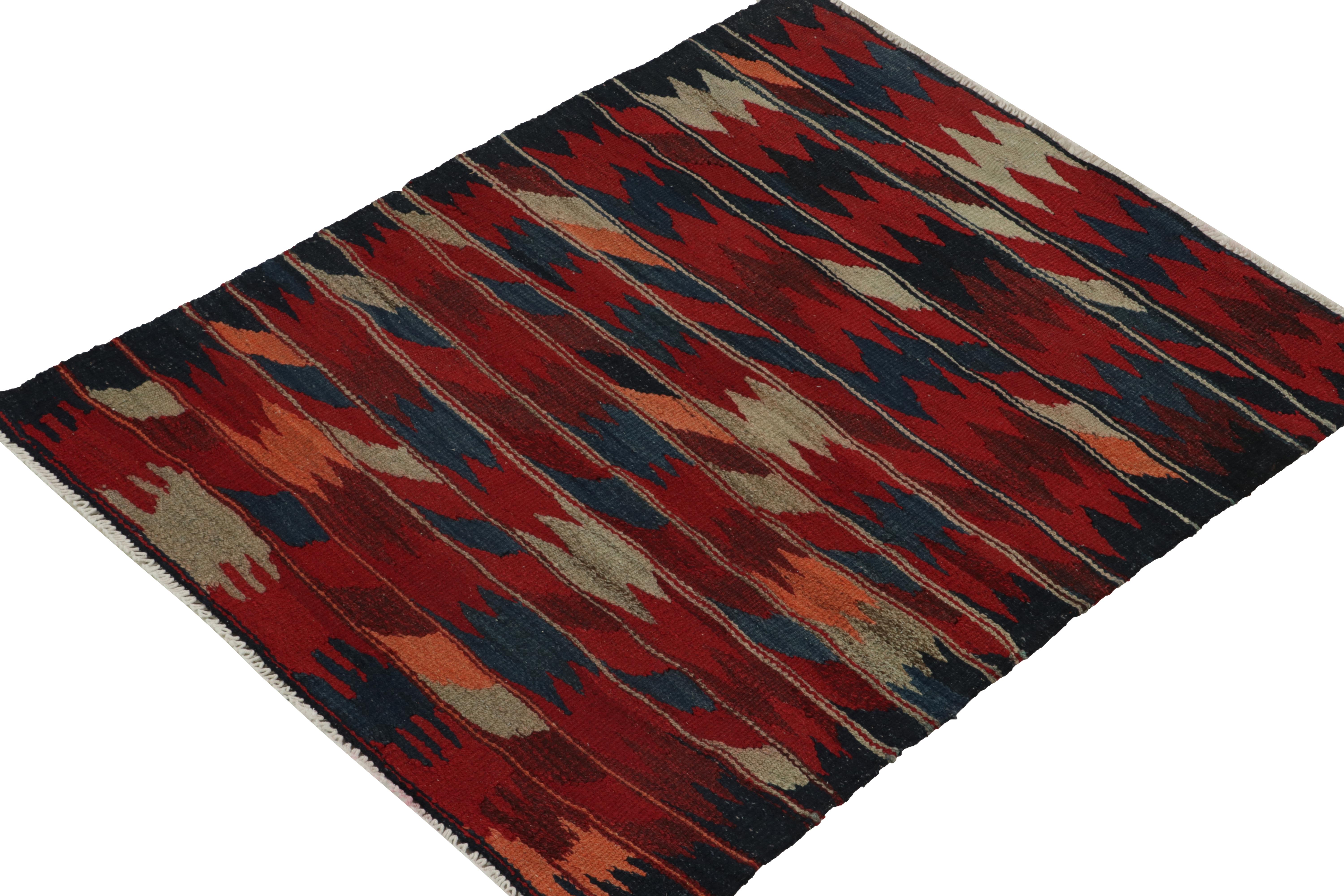 Connoting the celebrated tribal style, this 4x4 kilim rug hails from a special new curation of Persian Sofreh flat weaves. This square flatweave from the utilitous tribal lineage enjoys a geometric pattern alternating in tones of red, grey, peach &