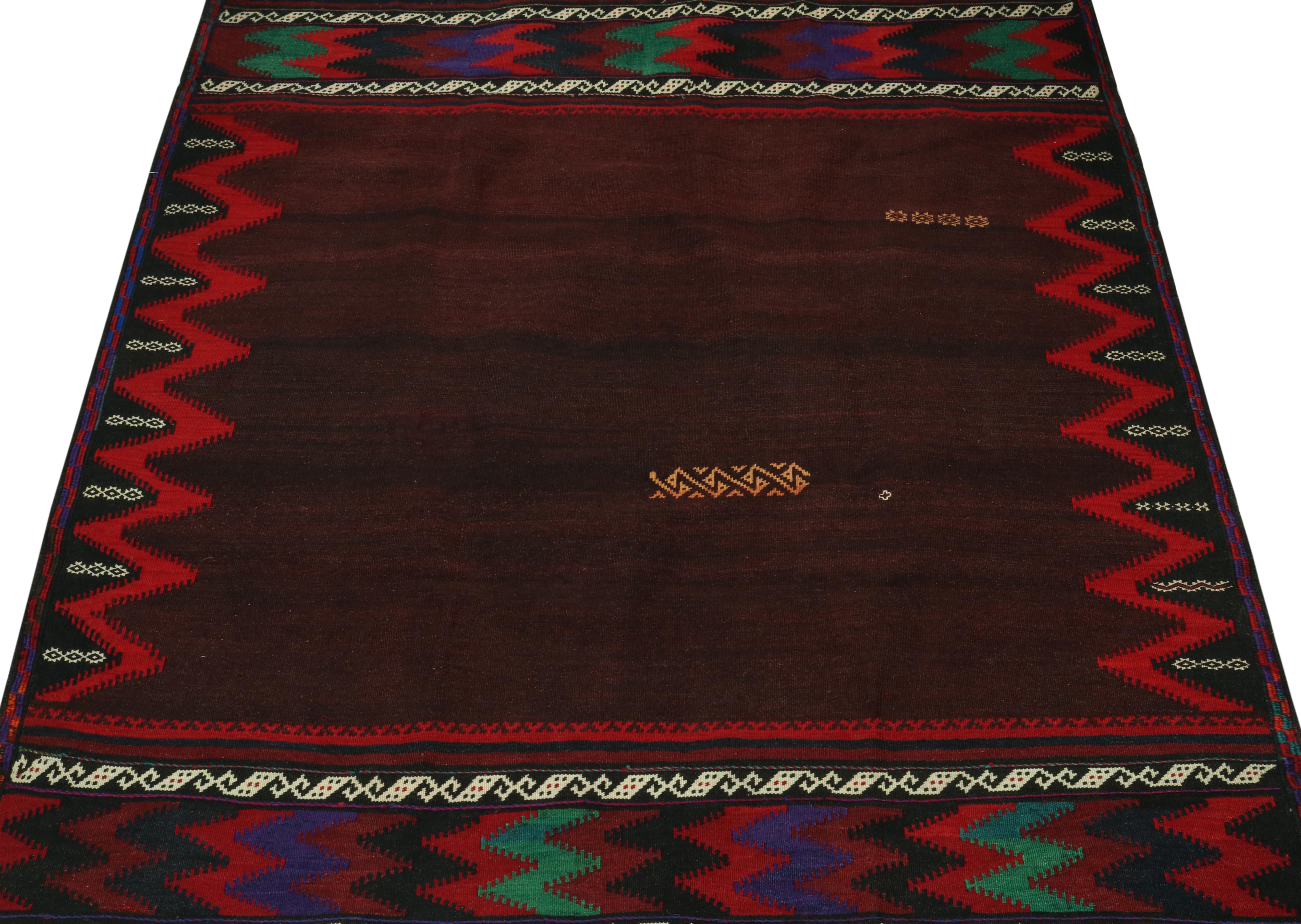 This vintage 4x4 square Persian kilim is a tribal Sofreh rug—handwoven in wool circa 1970-1980.

Further on the Design:

Sofreh Kilims like this piece are known for their minimalist patterns with vibrant colors and durable bodies. This particular