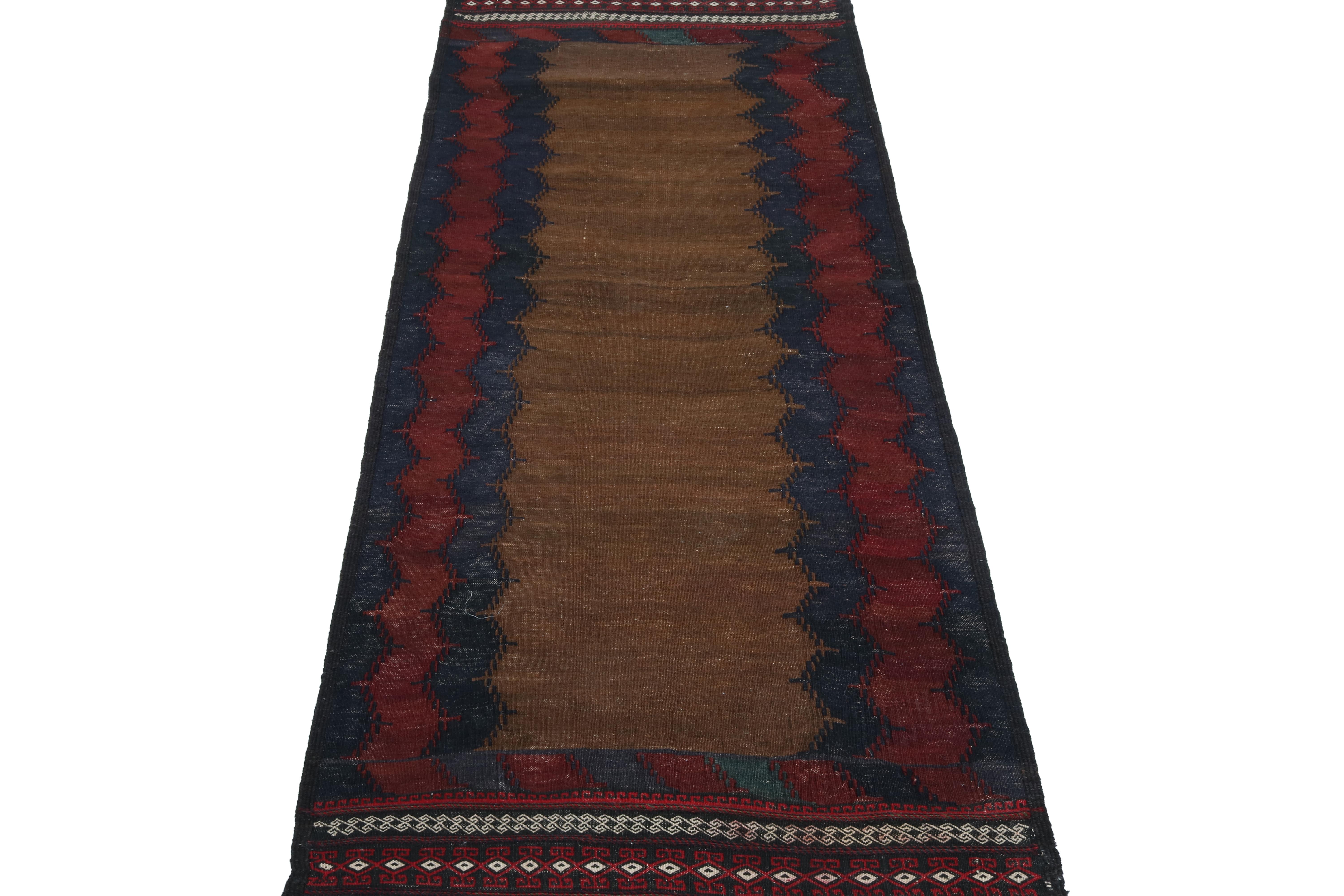This vintage 2x5 Persian kilim is a tribal Sofreh rug—handwoven in wool circa 1970-1980.

Further on the Design: 

Sofreh Kilims like this piece are known for their minimalist patterns with vibrant colors and durable bodies. This particular rug