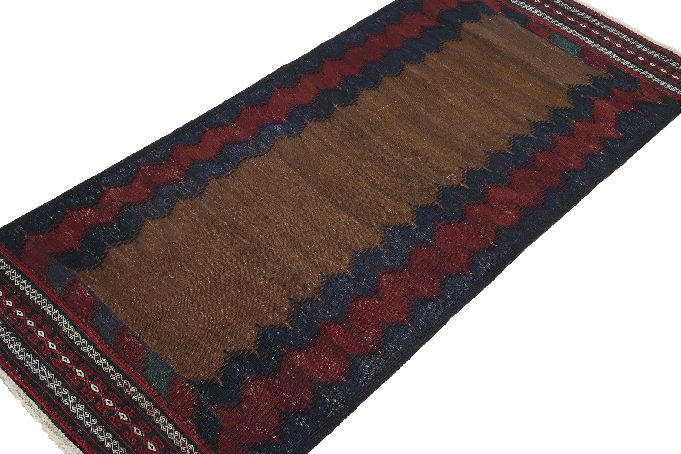 Tribal Vintage Sofreh Persian Kilim in Brown with Blue & Red Borders - by Rug & Kilim For Sale