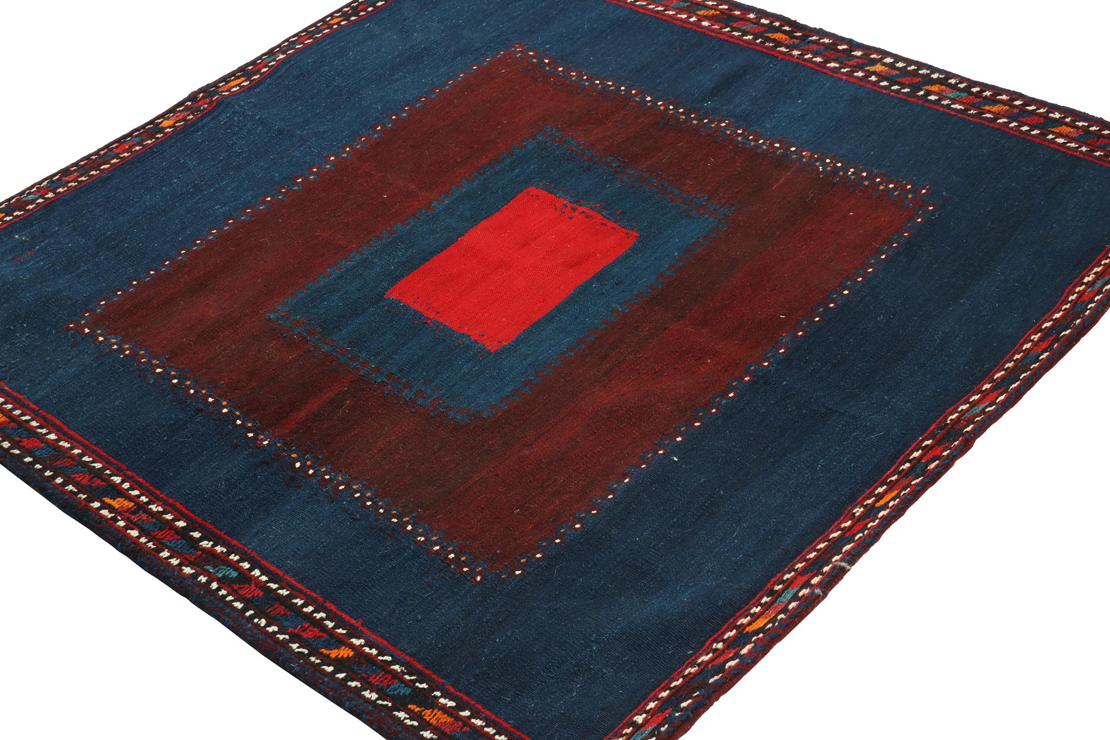 This vintage 4x4 square Persian kilim is a tribal Sofreh rug—handwoven in wool circa 1970-1980.

Further on the Design:

Sofreh Kilims like this piece are known for their minimalist patterns with vibrant colors and durable bodies. This piece enjoys