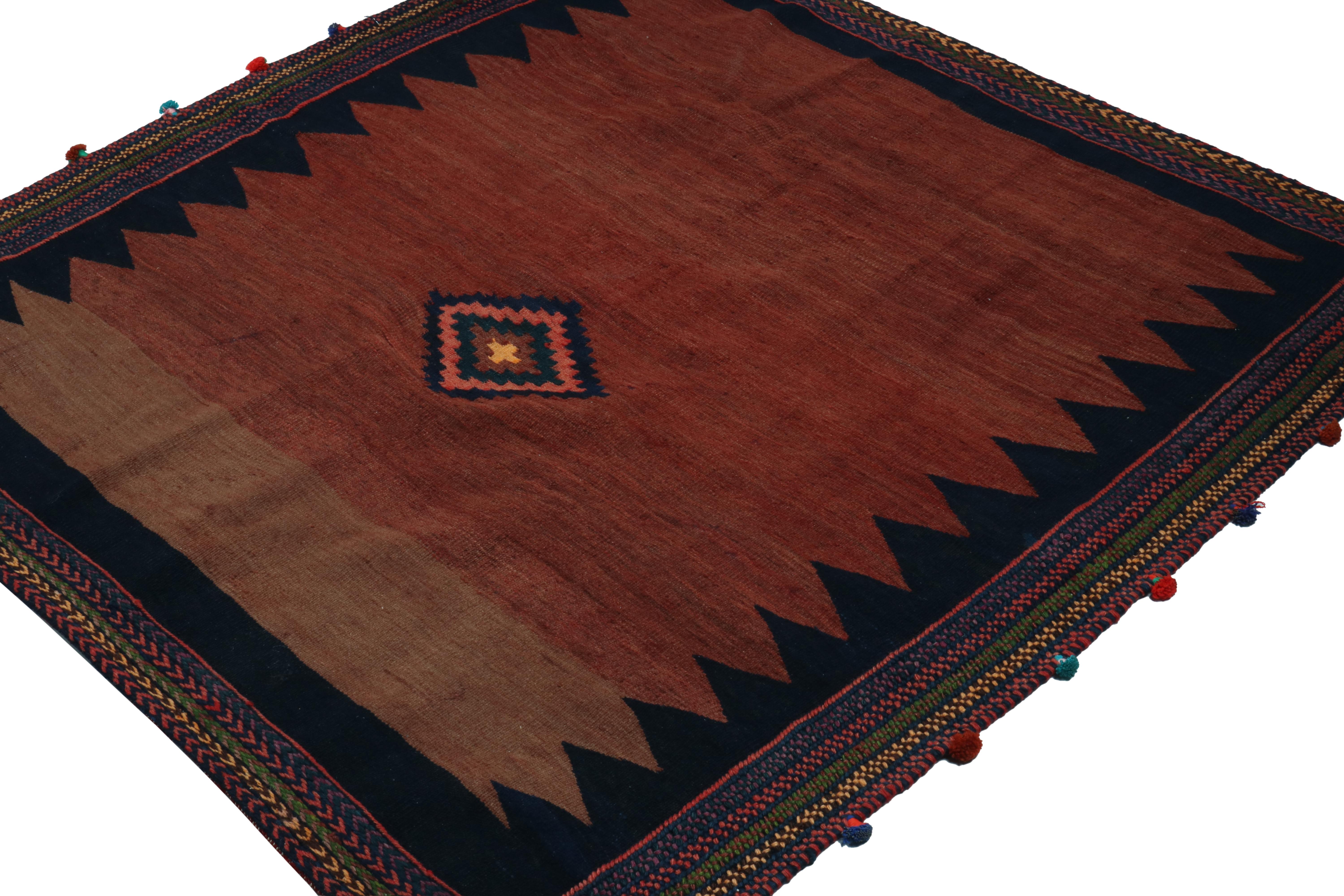 This vintage 4x4 Persian Kilim is a square rug of Sofreh provenance—handwoven in wool circa 1970-1980.

Further on the Design:

This piece employs a vibrant pink medallion that enjoys a natural center of gravity on the rich, rust brown