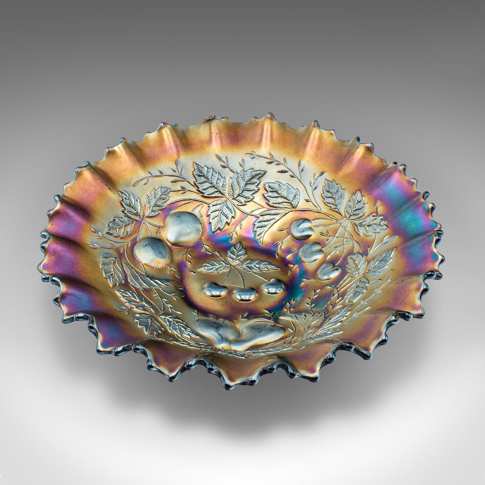 This is a vintage soft fruit dish. An English, carnival glass plate, dating to the late 20th century, circa 1970.

Striking lustre with a delightful colour palette
Displays a desirable aged patina and in good order
Deep red glass, upon which layers