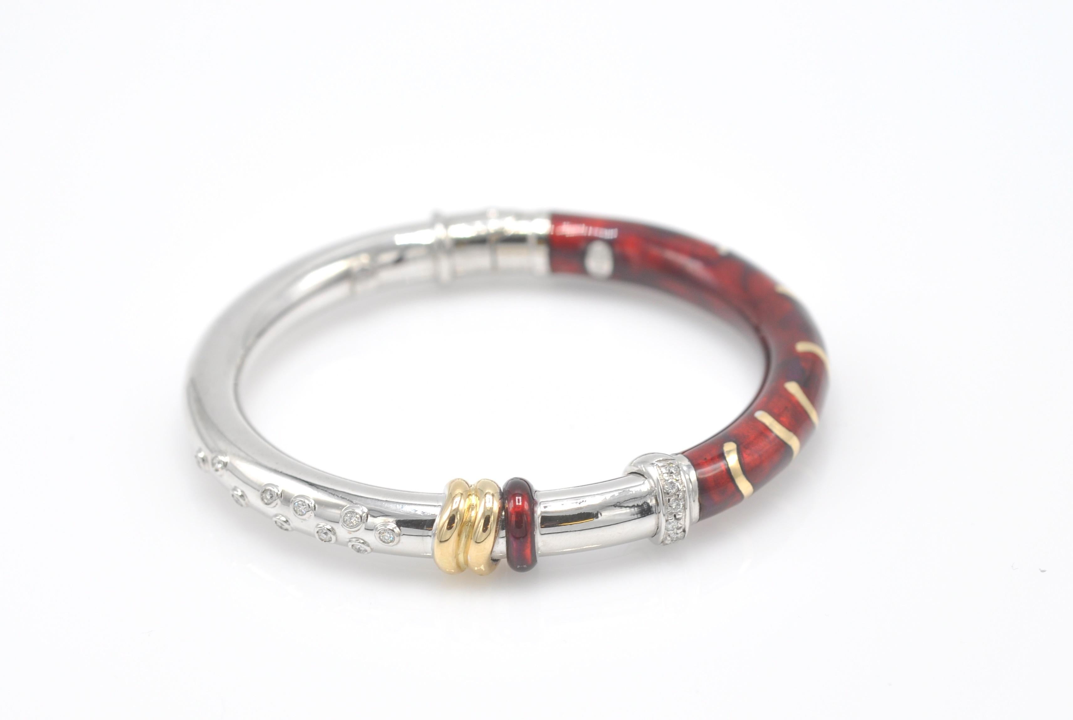 Vintage 18K White Gold, Red Enamel Bangle Bracelet with Yellow Gold Accent Bands and 0.30CTW Round Diamonds. This bracelet, designed and manufactured by SOHO in Italy, wears easily alone or in a group with other bangles. This item is stamped SOHO,