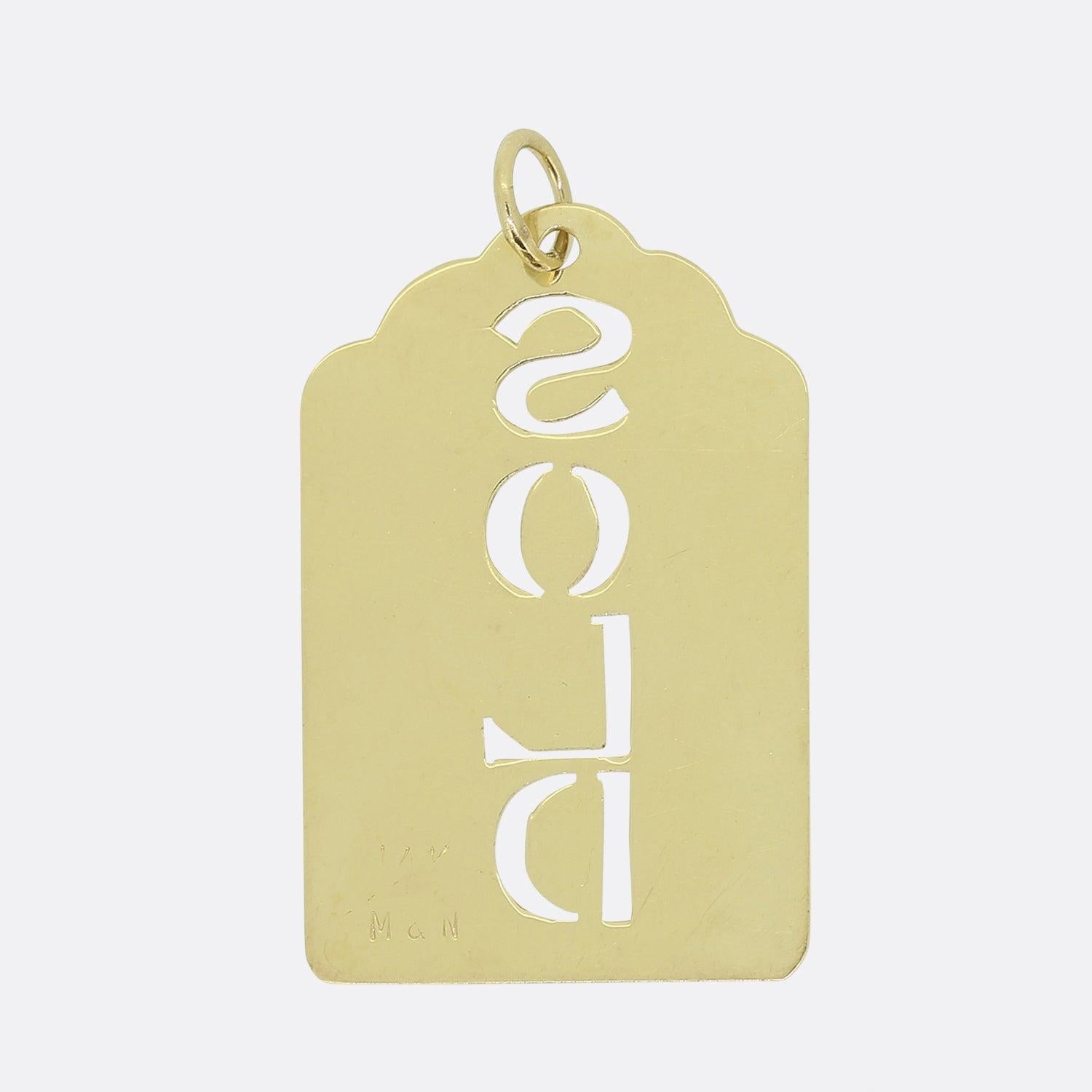 Here we have a classically designed tag pendant. This piece has been crafted from 14ct yellow gold with an expertly pierced mid-section which reads the word 'SOLD'. The rest of piece remains unembellished with a plain polished finish. 

Condition: