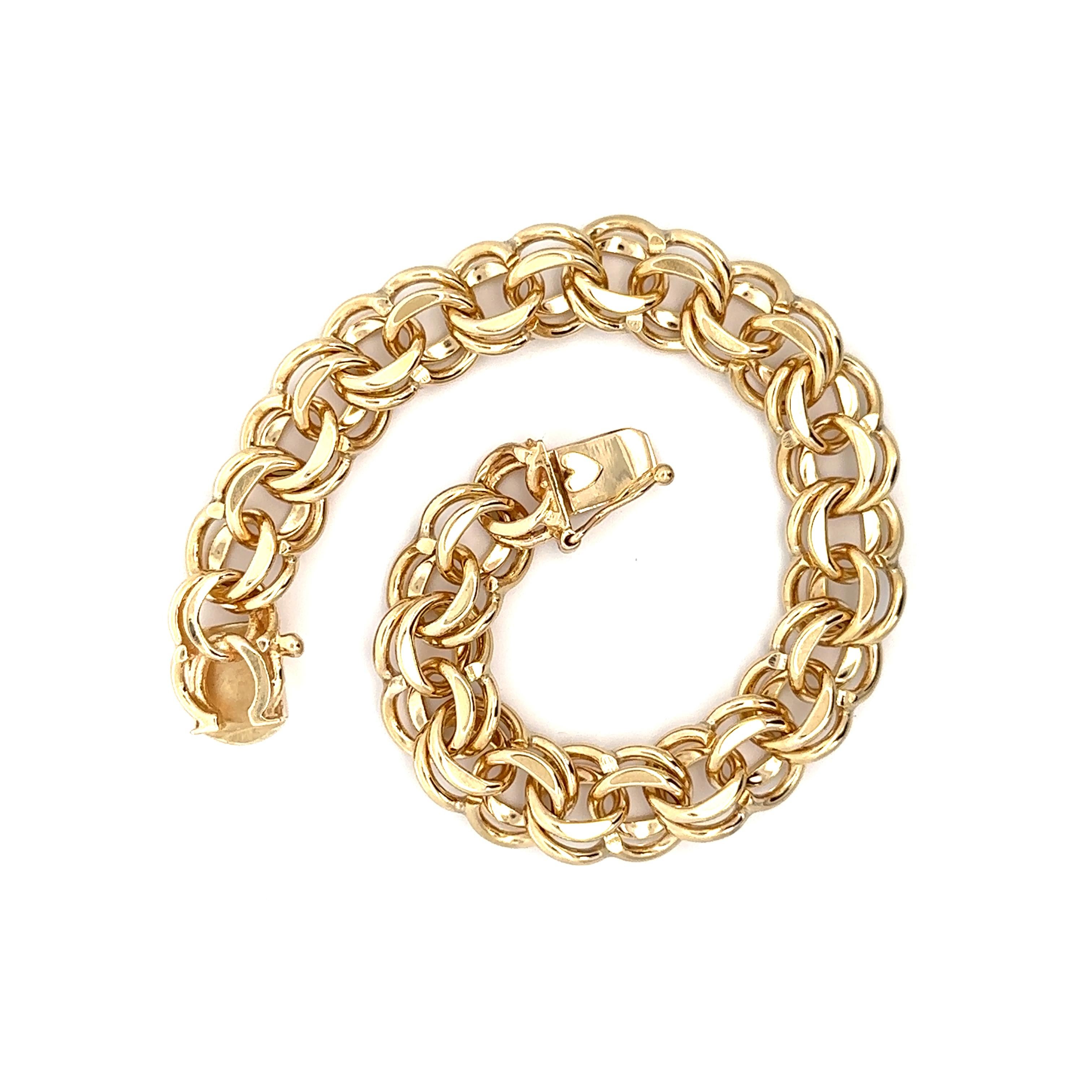Material: Solid 14k Yellow Gold 
Weight: 44.01 Grams
Chain Type: Dual Plain Curb Link
Chain Length:	Will fit a 7.5 Inch wrist (fitted on a wrist)
Clasp: Box Clasp w/ Safety Latch
Width: 11.7mm (0.46 in)
Thickness: 5.8mm (rise off the