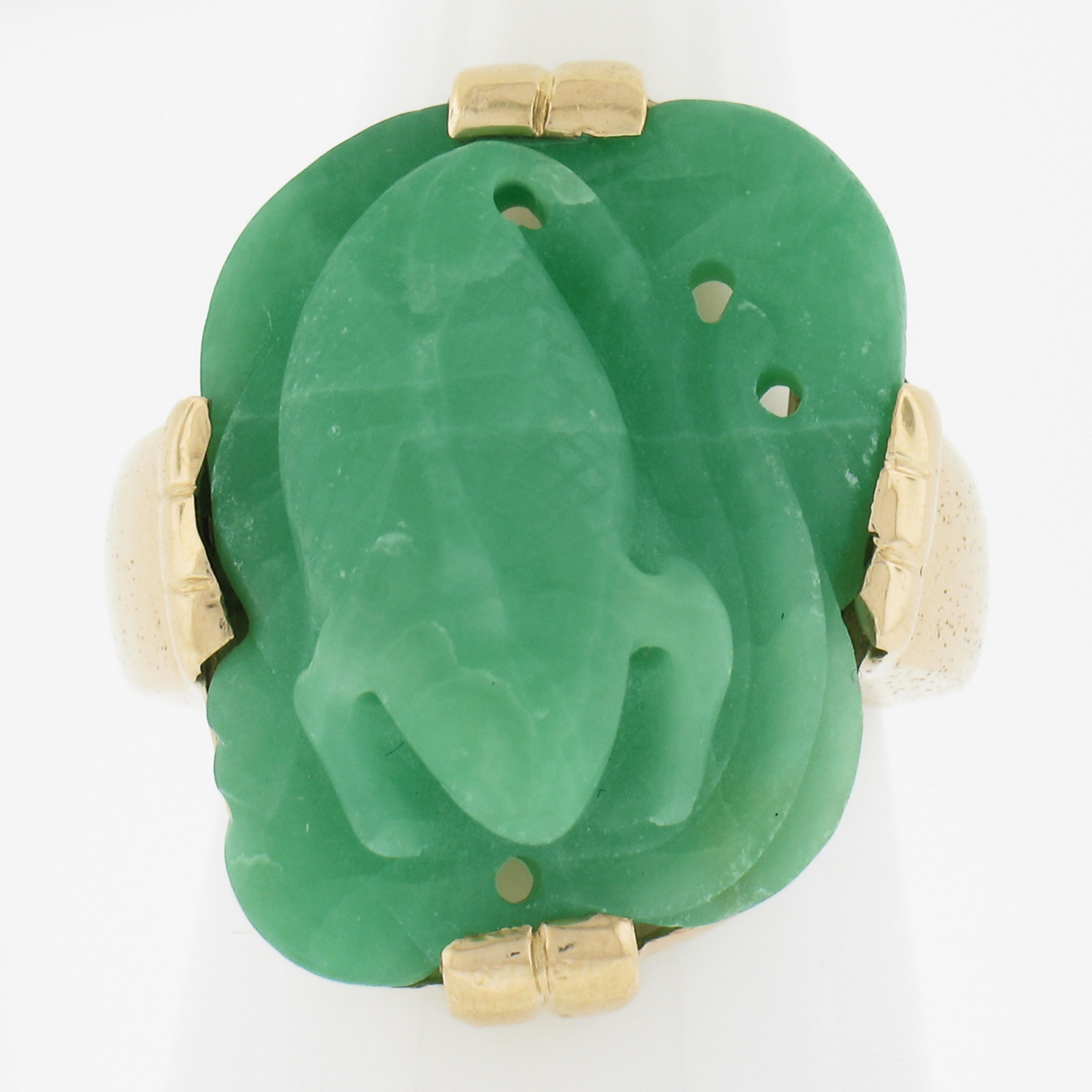 --Stone(s):--
(1) Natural Genuine Jade - Carved - Prong Set - Marbled Green & White Color - 21.5x17.2mm (approx.)

Material: Solid 14k Yellow Gold
Weight: 14.28 Grams
Ring Size: 6.5 (Fitted on a finger. We can custom size this ring - please contact