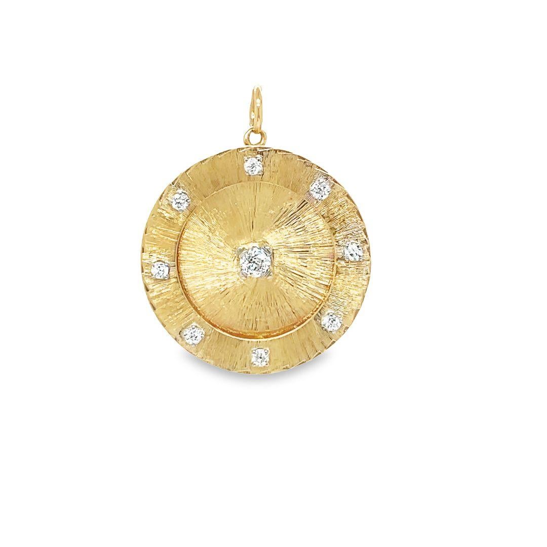 1950's - 1960's large round two tiered disc charm pendant crafted from 14K yellow gold. It features a dazzling center diamond (0.40 carat) and 8 diamonds (0.80 carat) on the outer edge, creating a total of 1.20 carats of brilliance.

The textured
