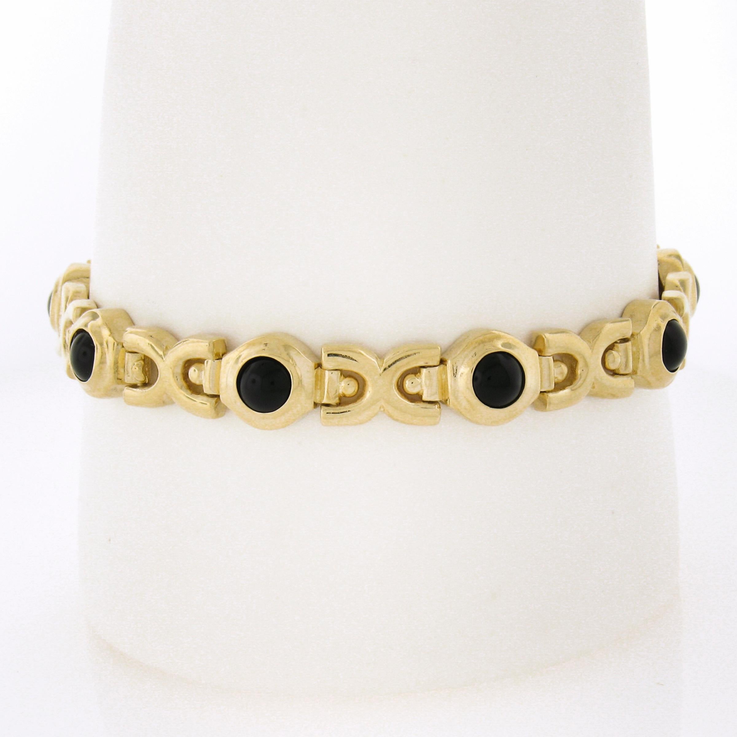This gorgeous, vintage piece was crafted from solid 14k yellow gold, Featuring a geometric link design. The bracelet features 8 round cabochon cut black onyx stones perfectly bezel set at the top, adding such an elegant and bold touch to the